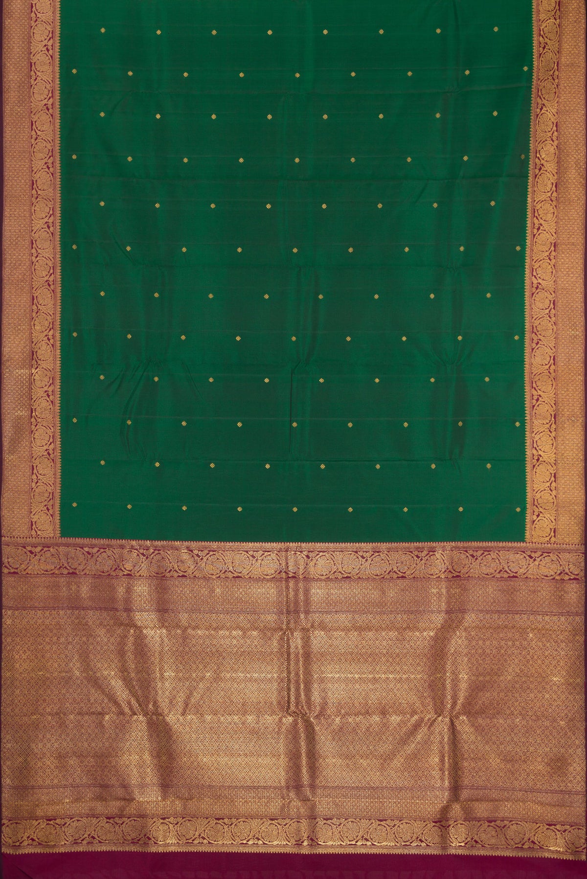Flat view of Pure Silk Pure Zari Bottle Green Kanjivaram Saree with Zari Butta on the body and Fancy Border. 