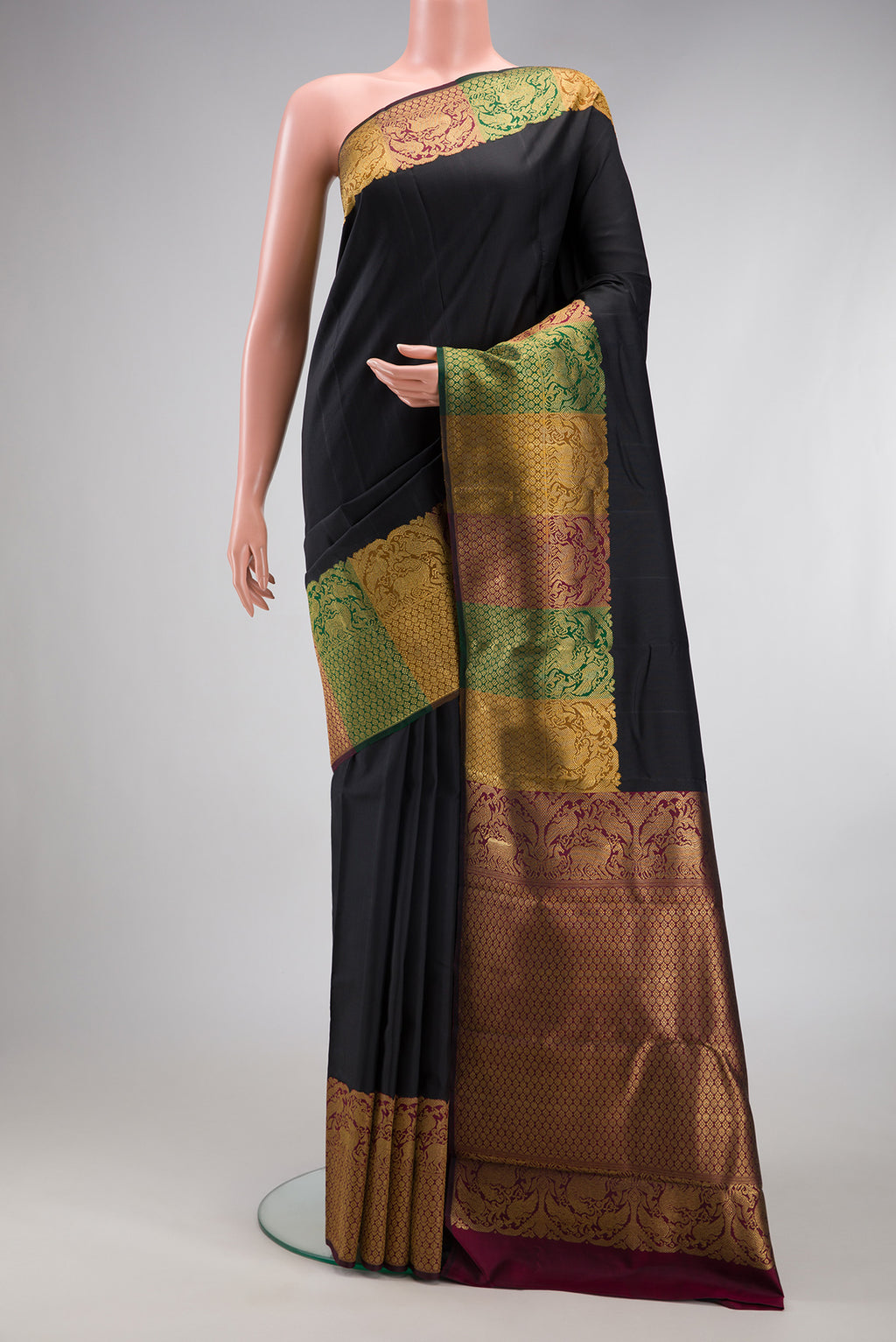 Pure Silk Pure Zari Black Kanjivaram Saree with Plain Body and Fancy Border.  displayed on a mannequin
