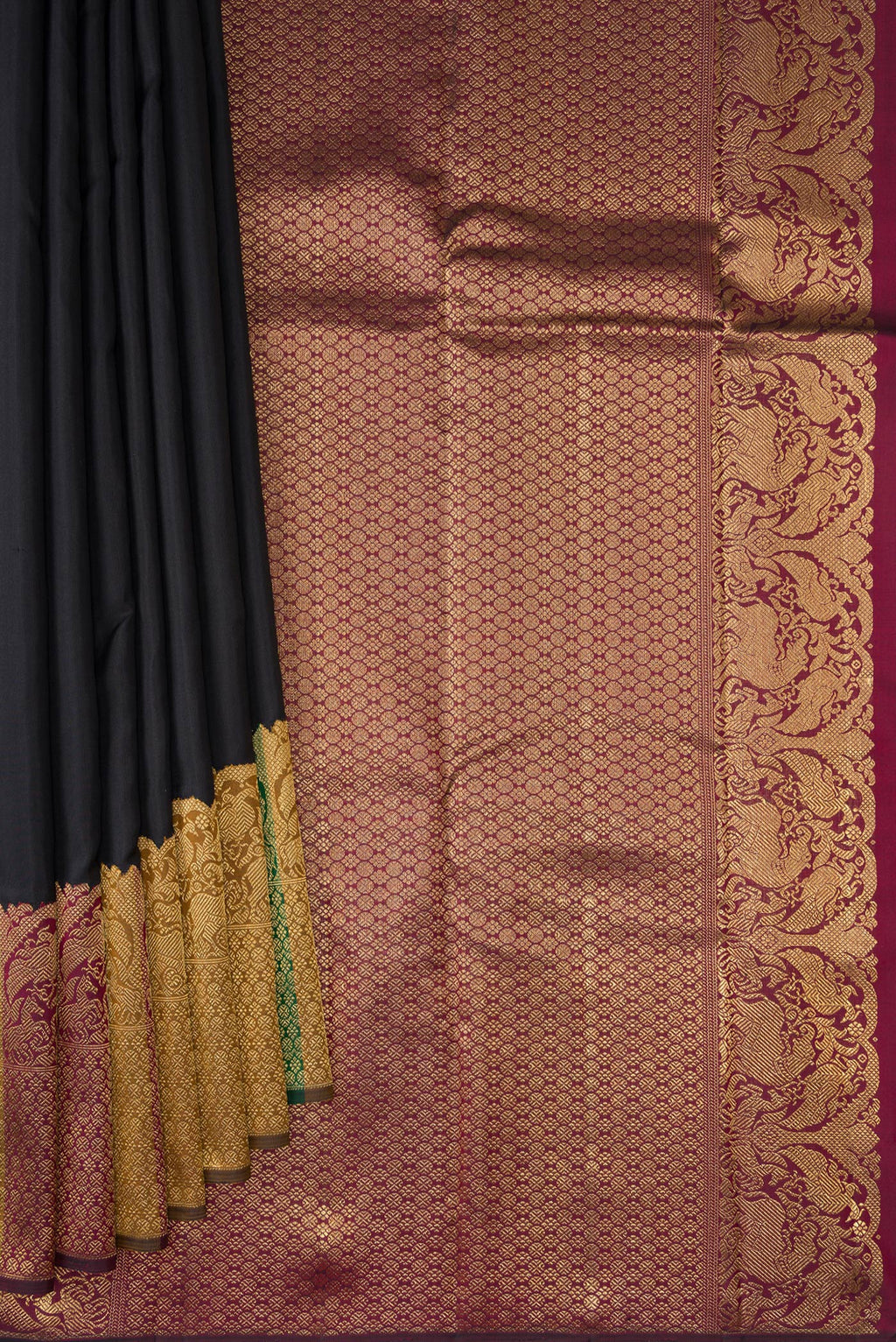 Pleats and pallu of Pure Silk Pure Zari Black Kanjivaram Saree with Plain Body and Fancy Border. 
