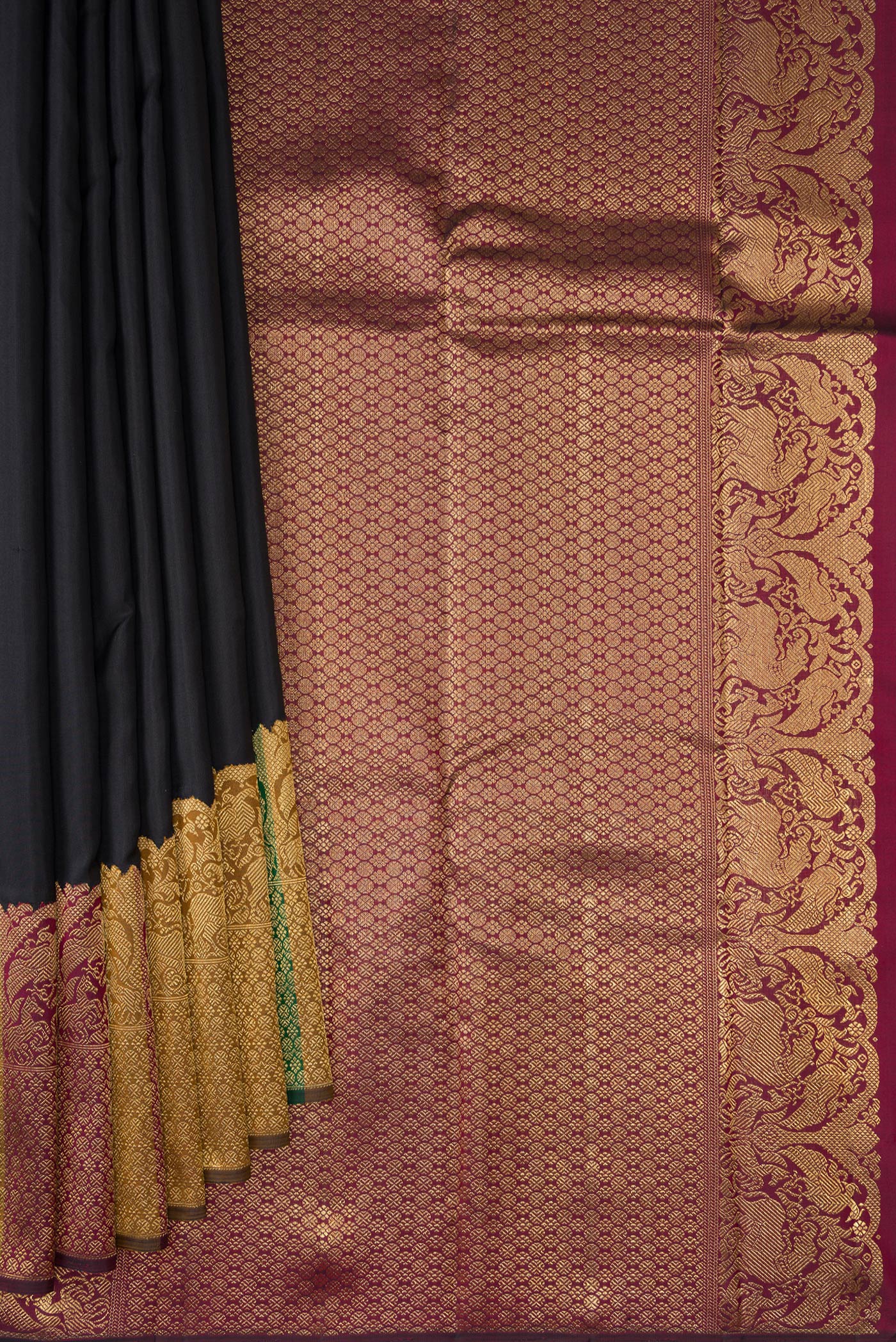Pleats and pallu of Pure Silk Pure Zari Black Kanjivaram Saree with Plain Body and Fancy Border. 