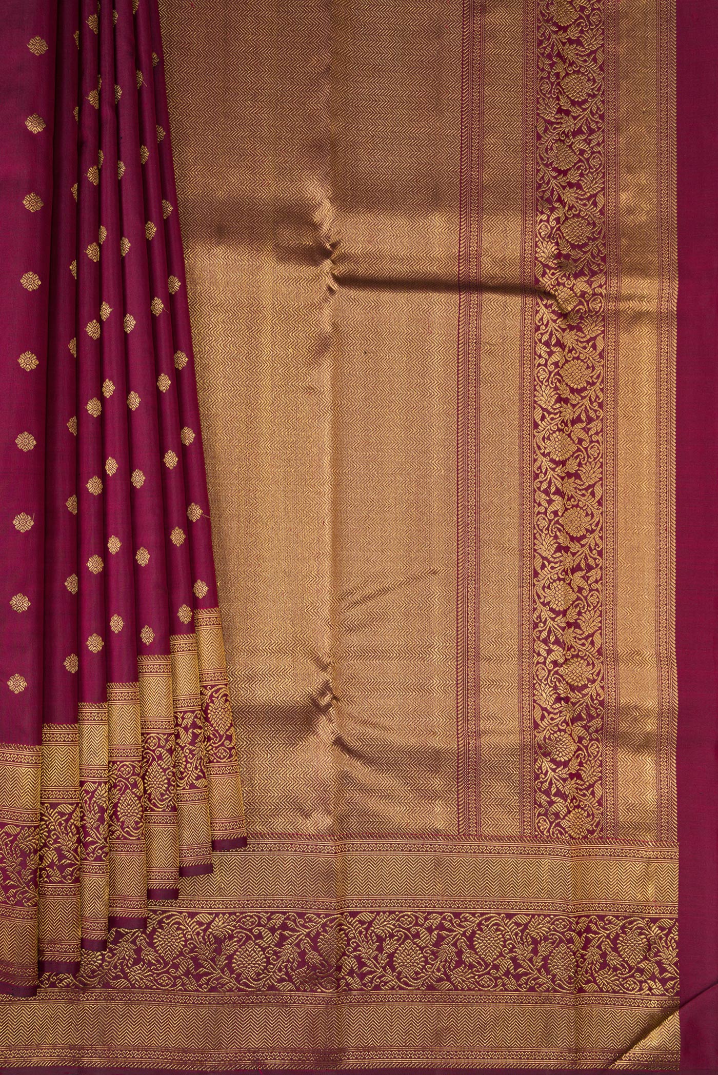 Pleats and pallu of Pure Silk Pure Zari Maroon Kanjivaram Saree with Zari Butta on the body and Fancy Border. 