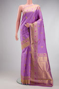 Pure Silk Pure Zari Lavender Kanjivaram Saree with Zari And Thread Butta on the body and Fancy Border.  displayed on a mannequin
