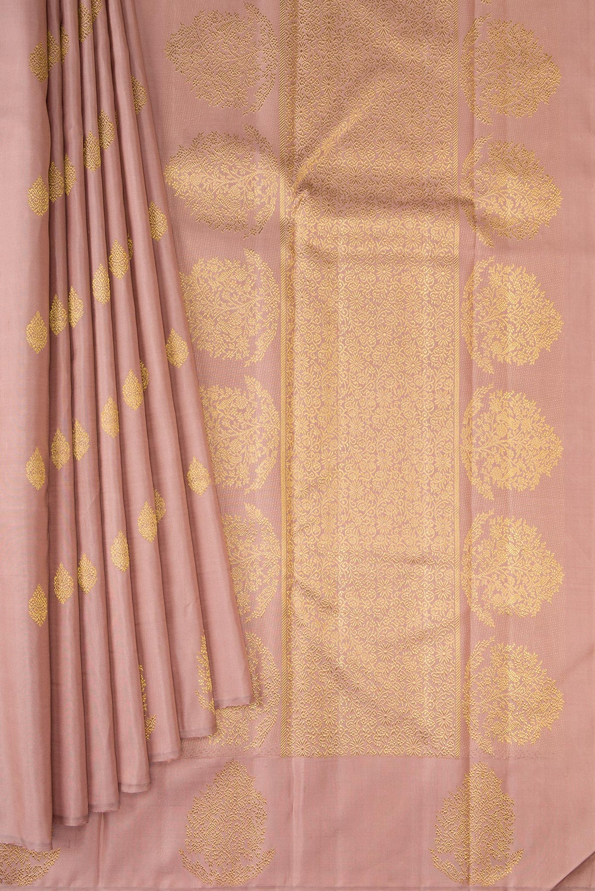 Pleats and pallu of Pure Silk Pure Zari Rose Gold Kanjivaram Saree with Zari Butta on the body and Fancy Border. 