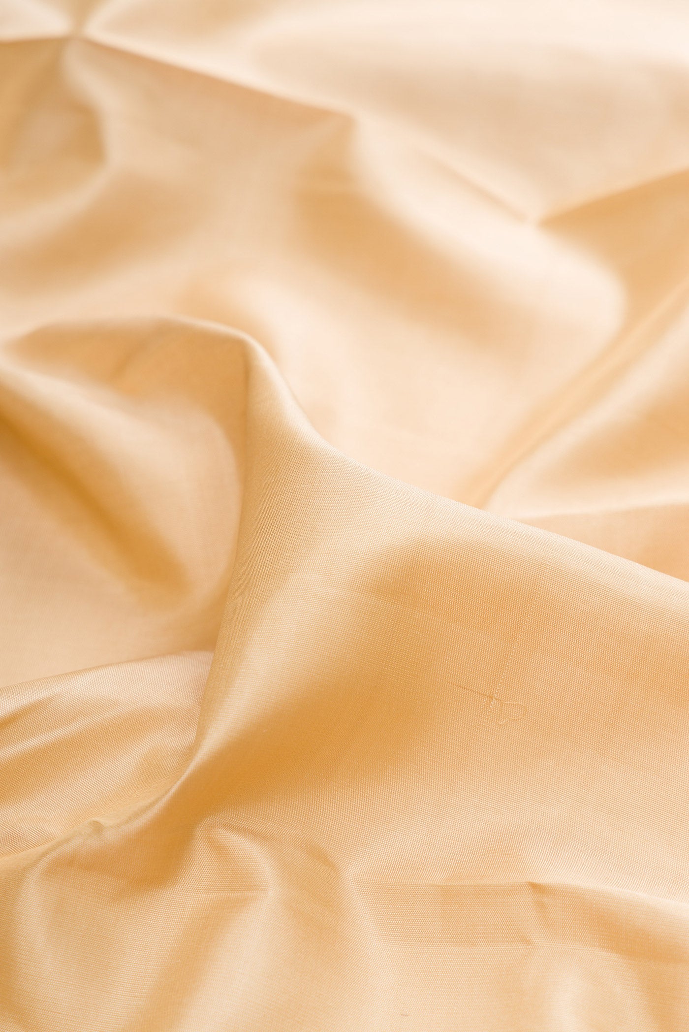 Close up of Pure Silk Pure Zari Sandal Kanjivaram Saree with Plain Body and Fancy Border.  displaying folds