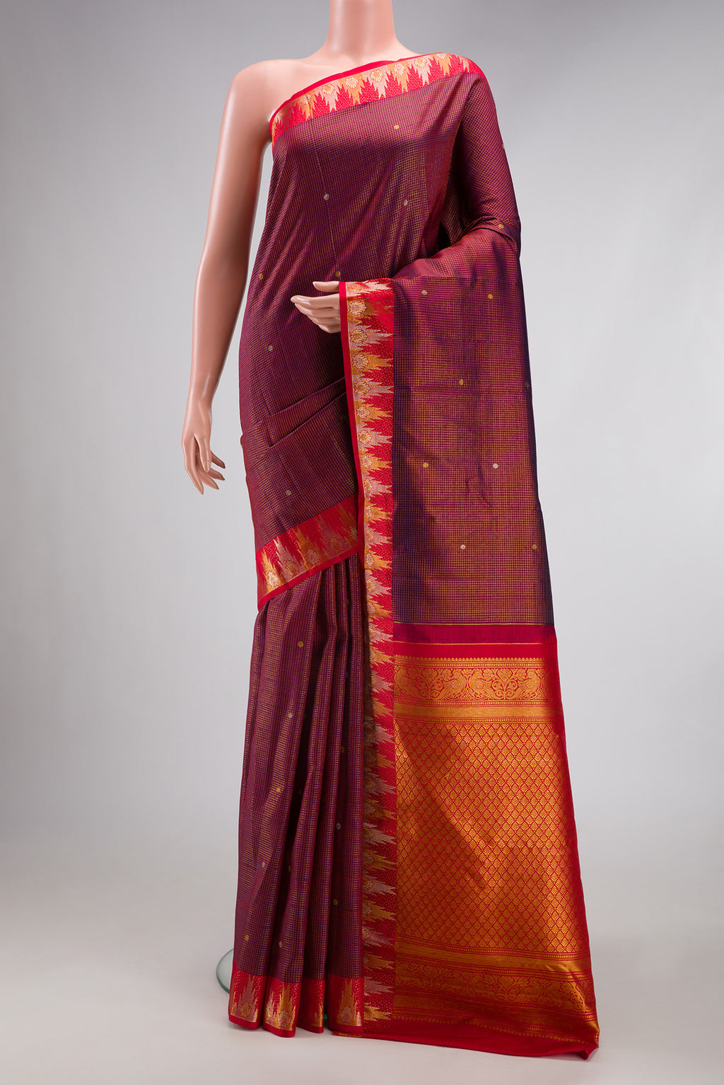 Maroon Kanjivaram Silk Saree with Checked design on the body and Temple Border.  displayed on a mannequin