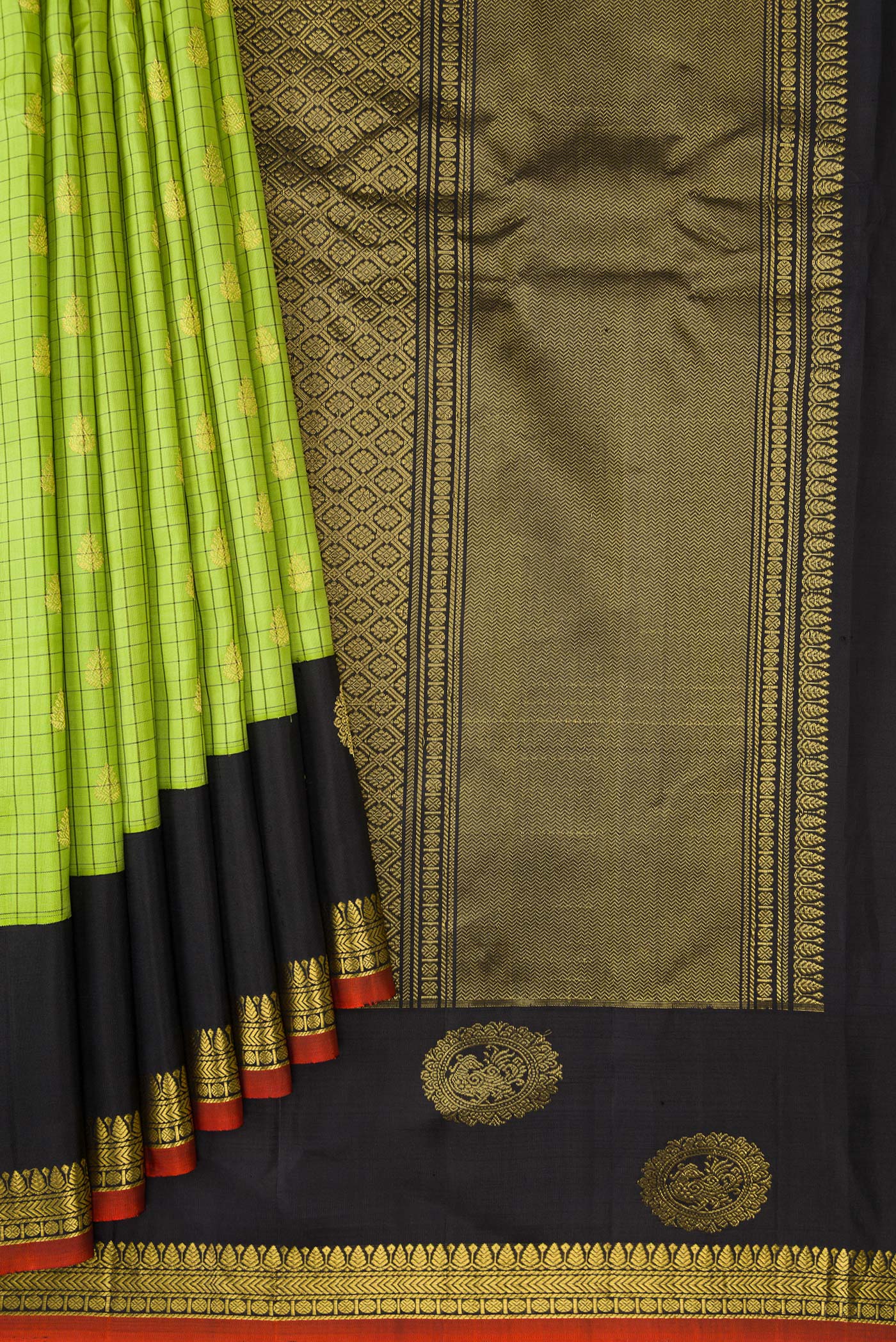 Pleats and pallu of Parrot Green Gadwal Silk Saree with Checked design on the body and Zari Border. 