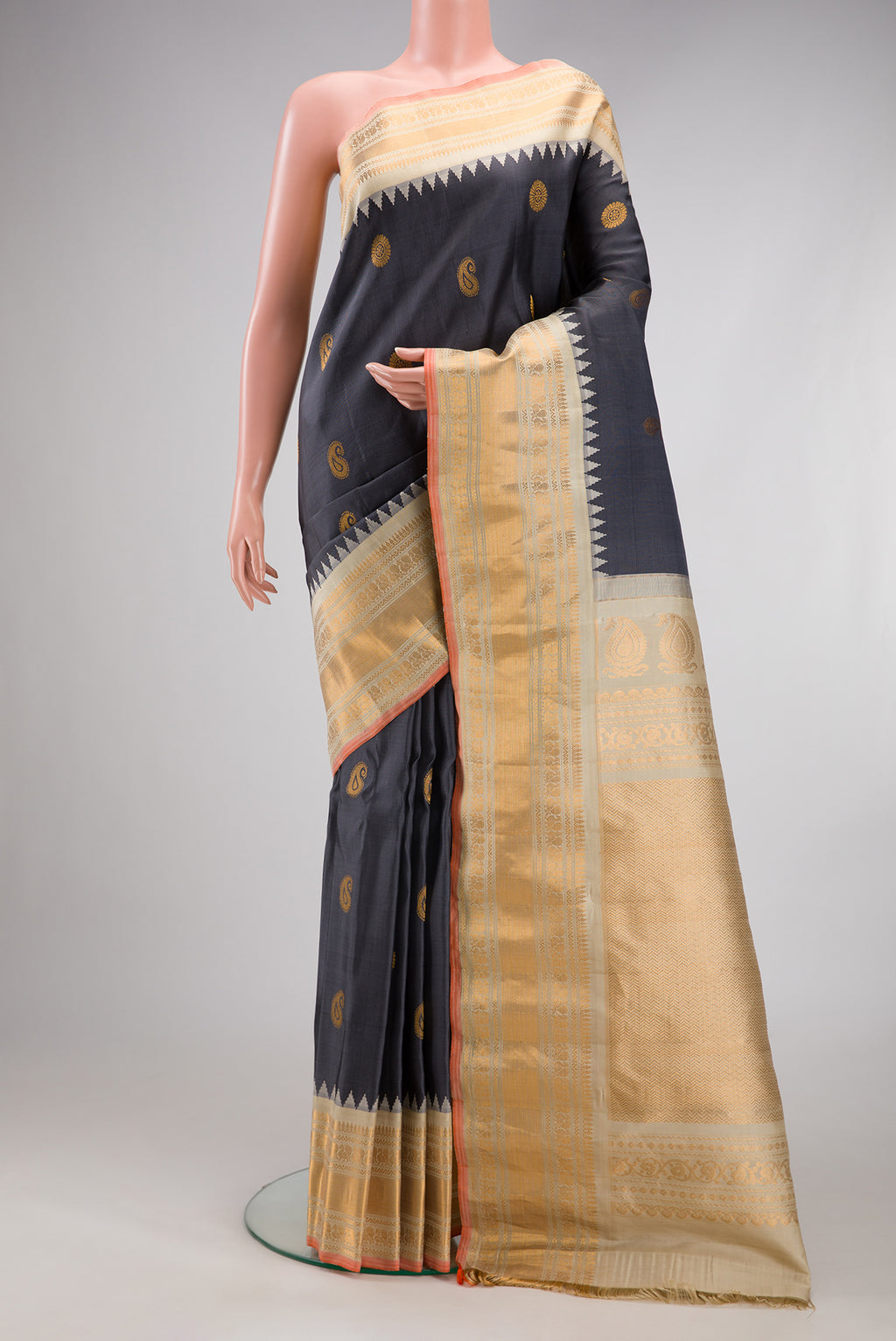 Grey Gadwal Silk Saree with Zari Butta on the body and Zari Border.  displayed on a mannequin