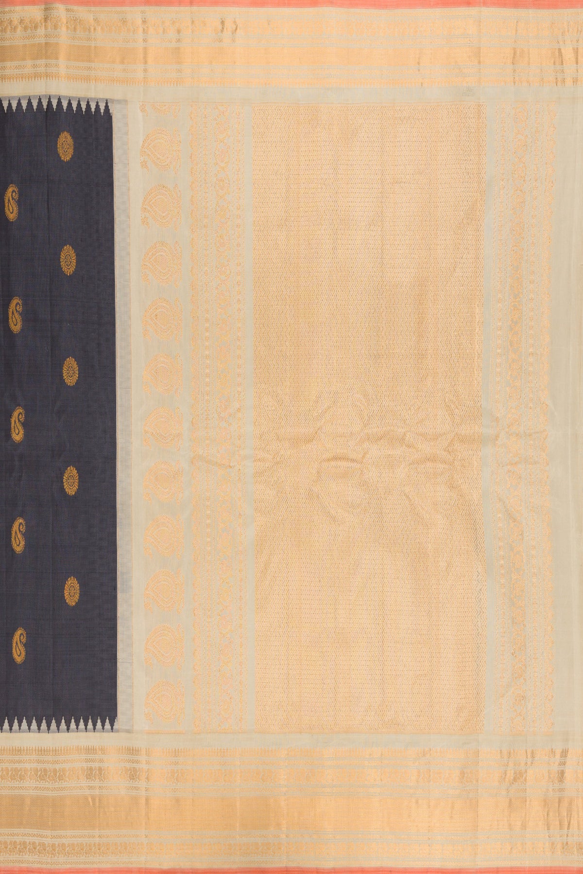 Close up image of the pallu of Grey Gadwal Silk Saree with Zari Butta on the body and Zari Border. 