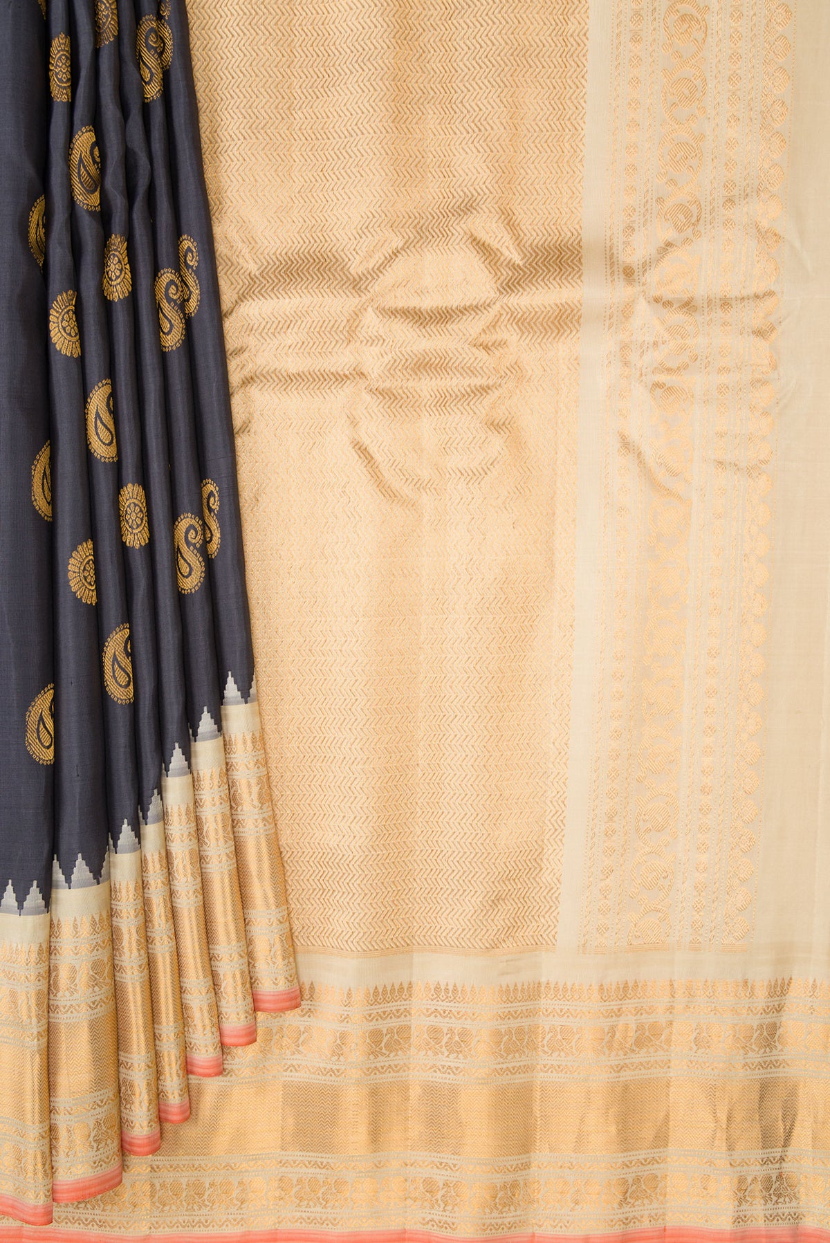 Pleats and pallu of Grey Gadwal Silk Saree with Zari Butta on the body and Zari Border. 