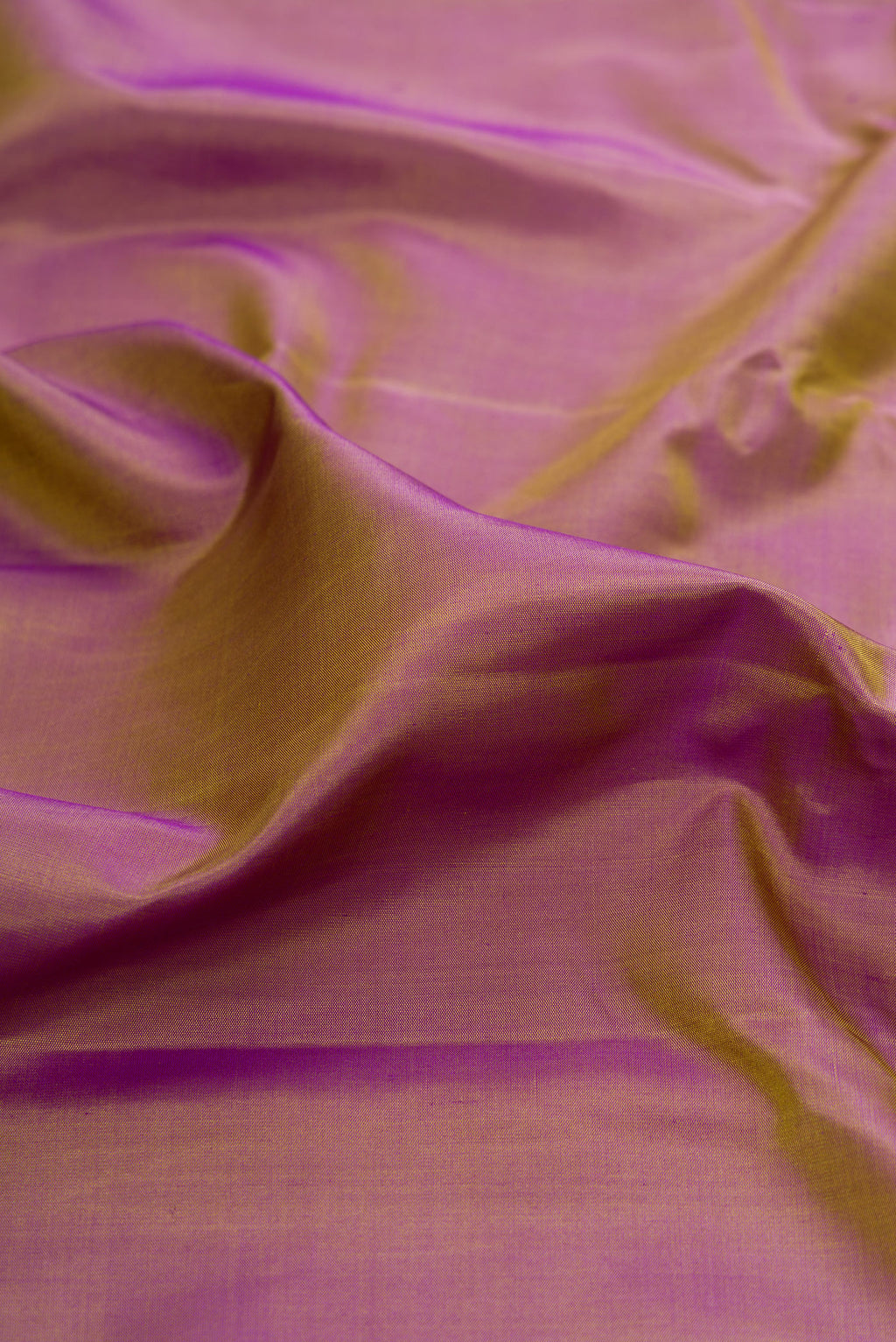 Close up of Purple Dual Tone Gadwal Silk Saree with Plain Body and Zari Border.  displaying folds