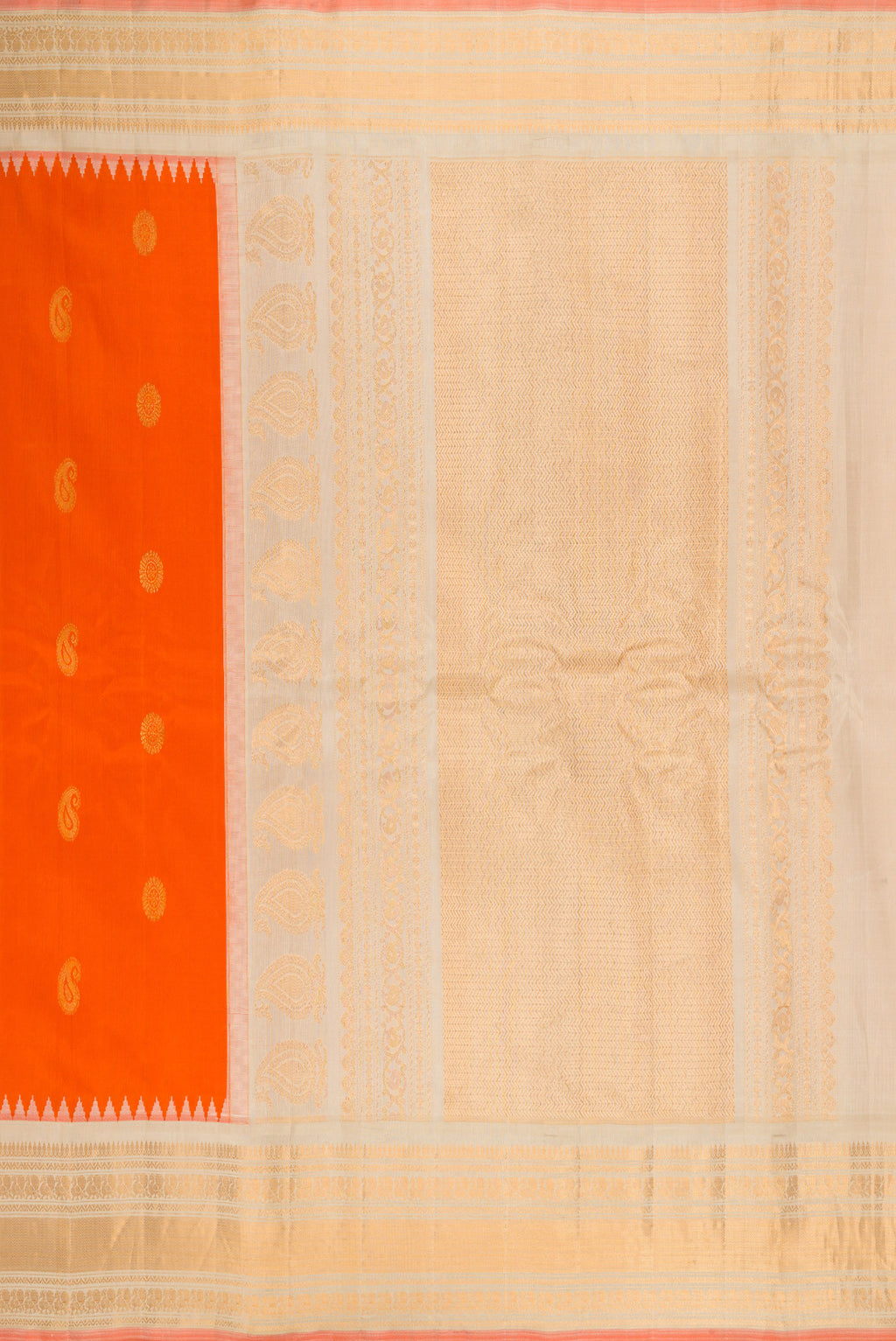 Close up image of the pallu of Orange Gadwal Silk Saree with Zari Butta on the body and Zari Border. 