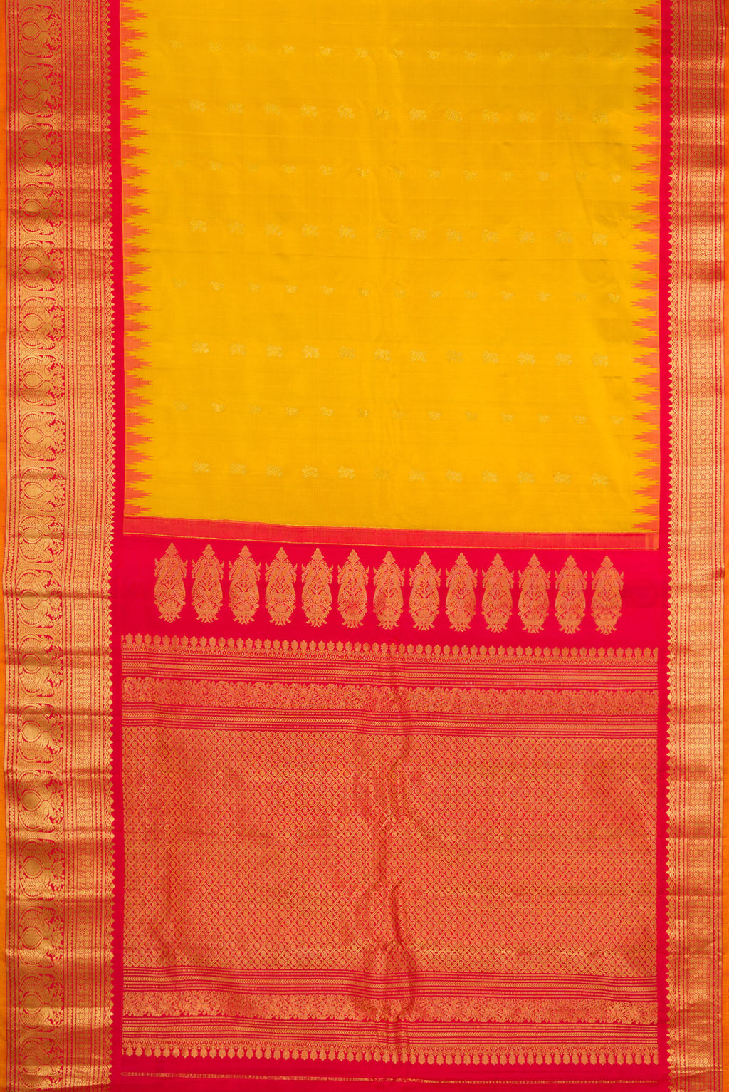 Flat view of Mustard Gadwal Silk Saree with Zari Butta on the body and Zari Border. 
