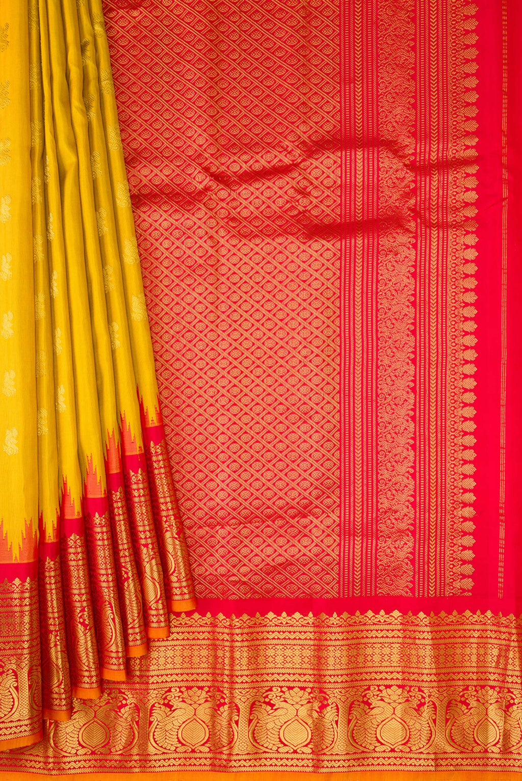 Pleats and pallu of Mustard Gadwal Silk Saree with Zari Butta on the body and Zari Border. 