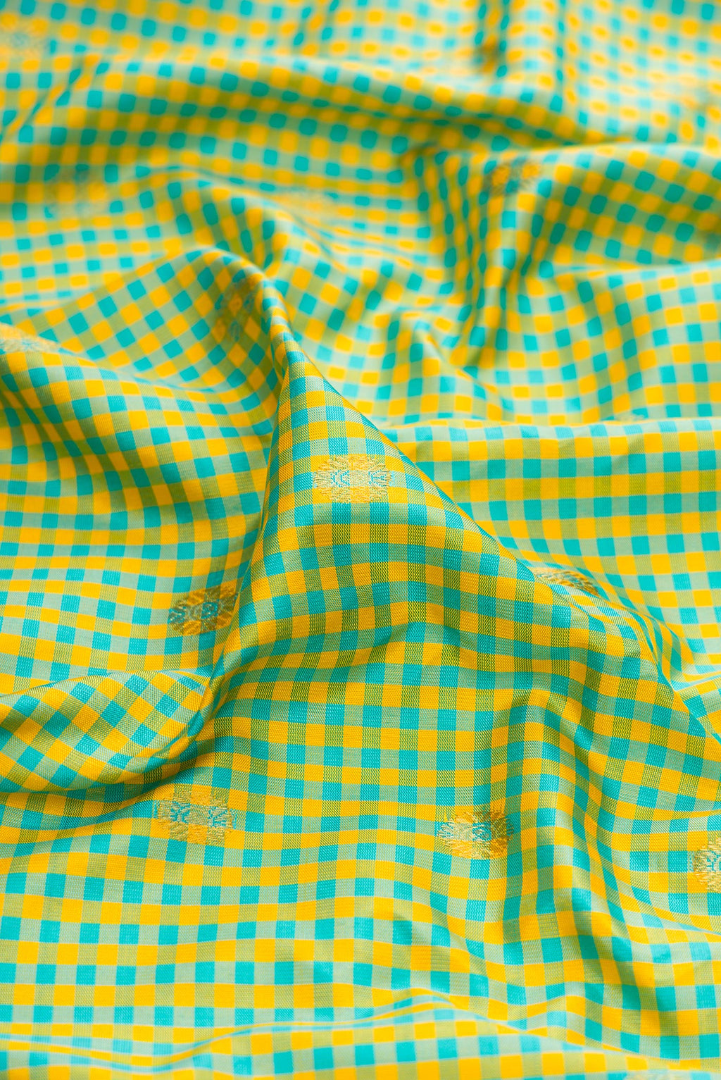 Close up of Light Green Gadwal Silk Saree with Checked design on the body and Zari Border.  displaying folds