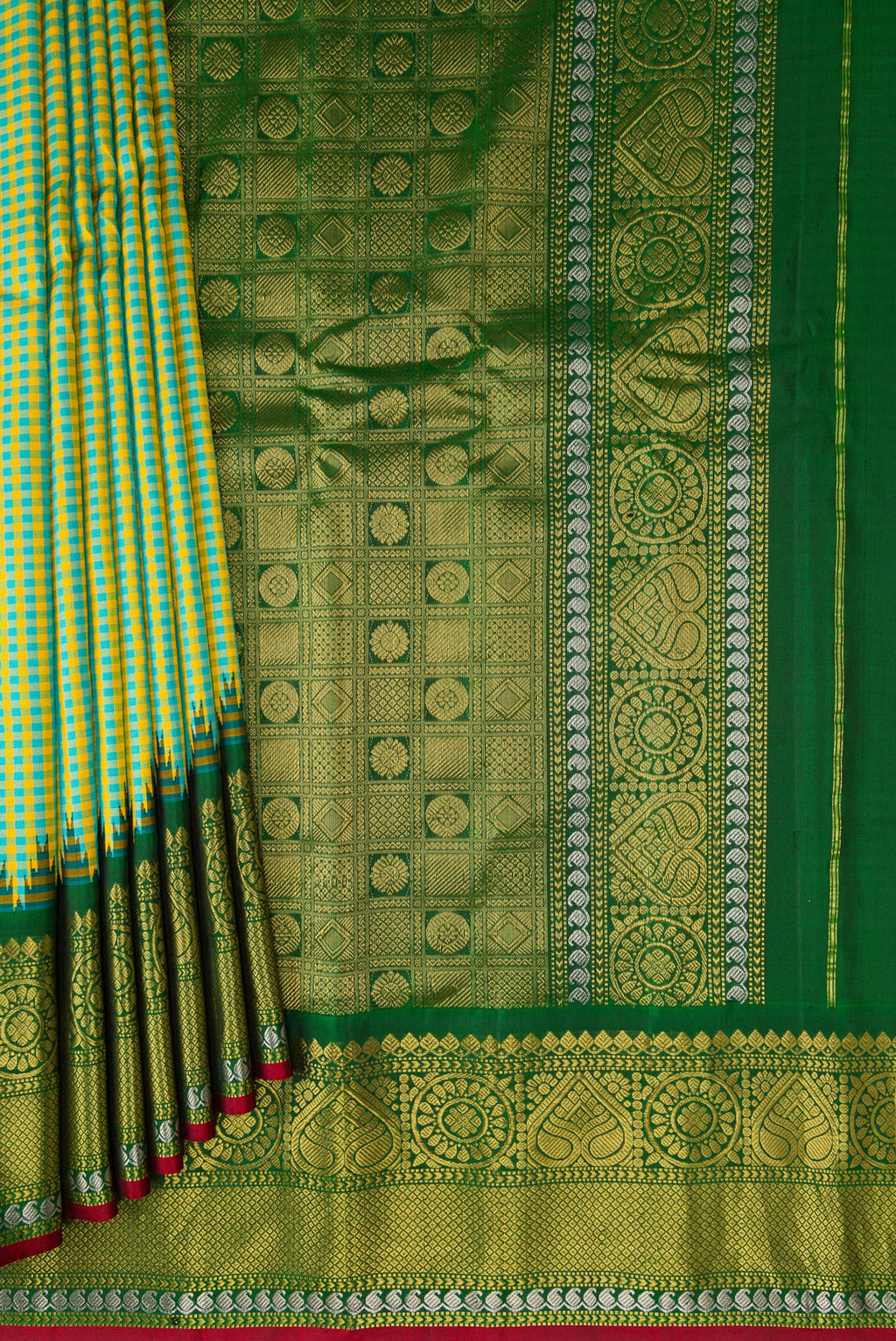 Pleats and pallu of Light Green Gadwal Silk Saree with Checked design on the body and Zari Border. 
