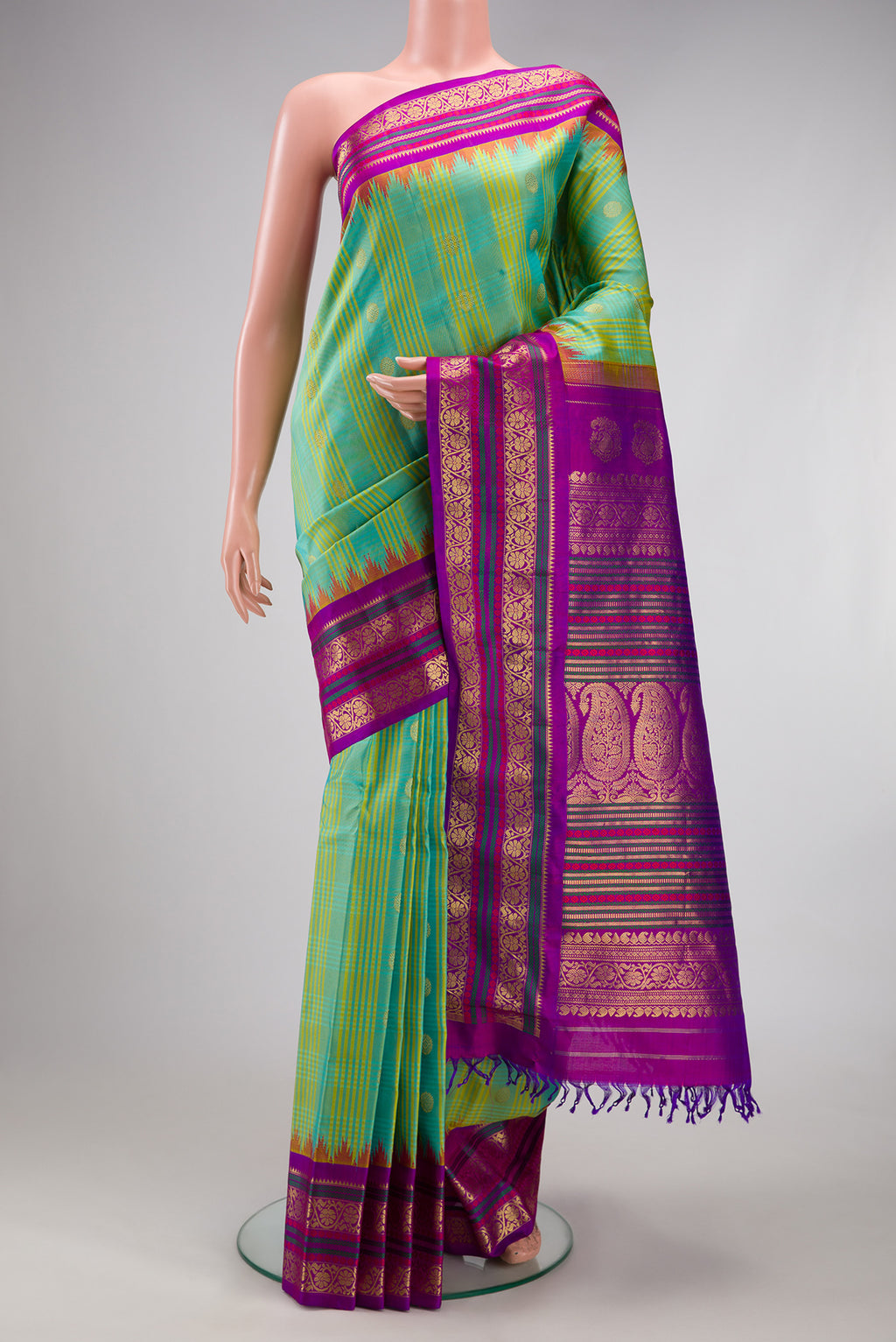 Sea Green Gadwal Silk Saree with Checked design on the body and Zari Border.  displayed on a mannequin