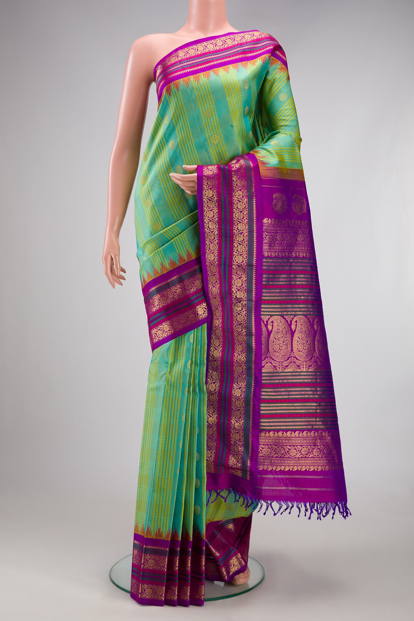 Sea Green Gadwal Silk Saree with Checked design on the body and Zari Border.  displayed on a mannequin