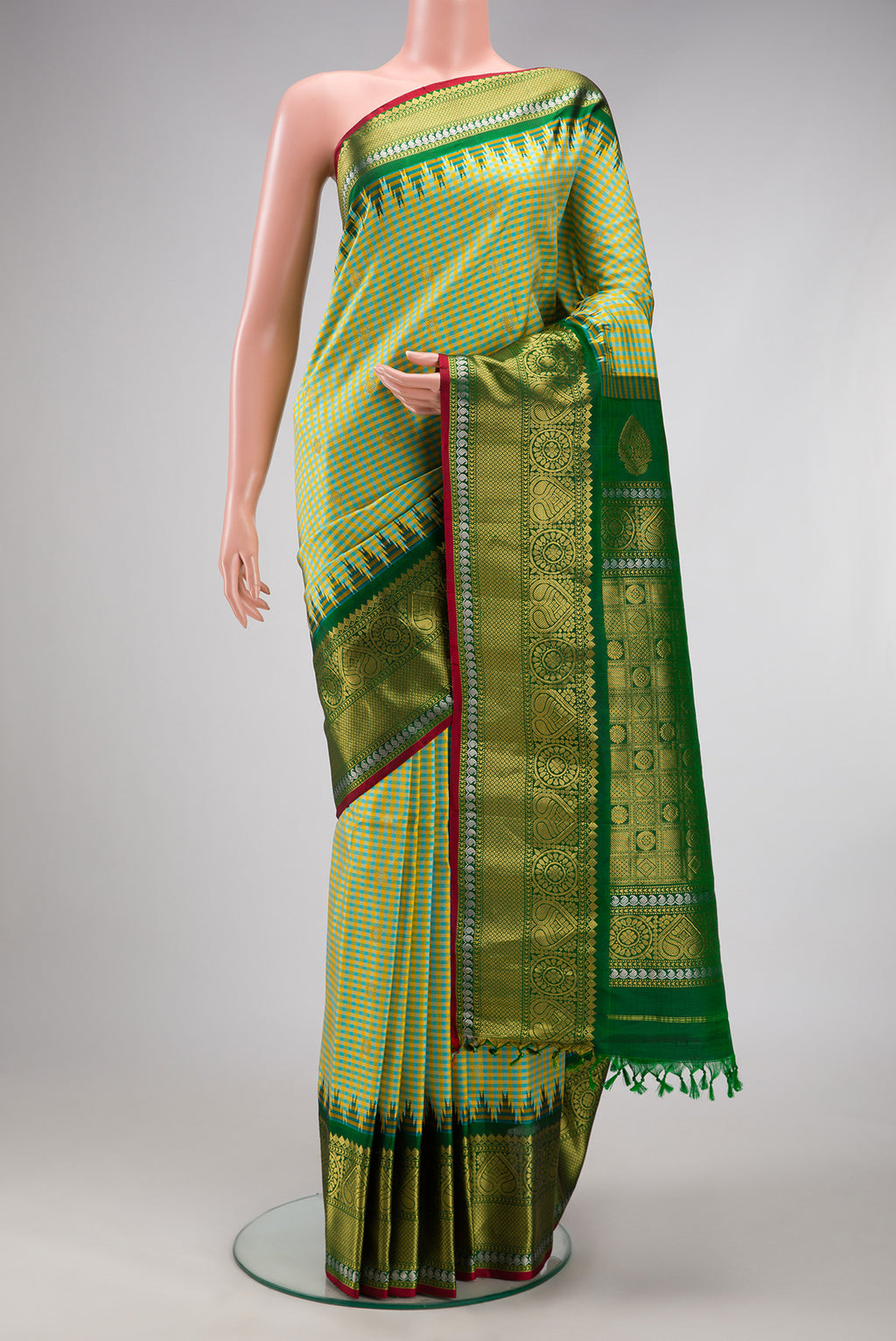 Pista Green Gadwal Silk Saree with Checked design on the body and Zari Border.  displayed on a mannequin