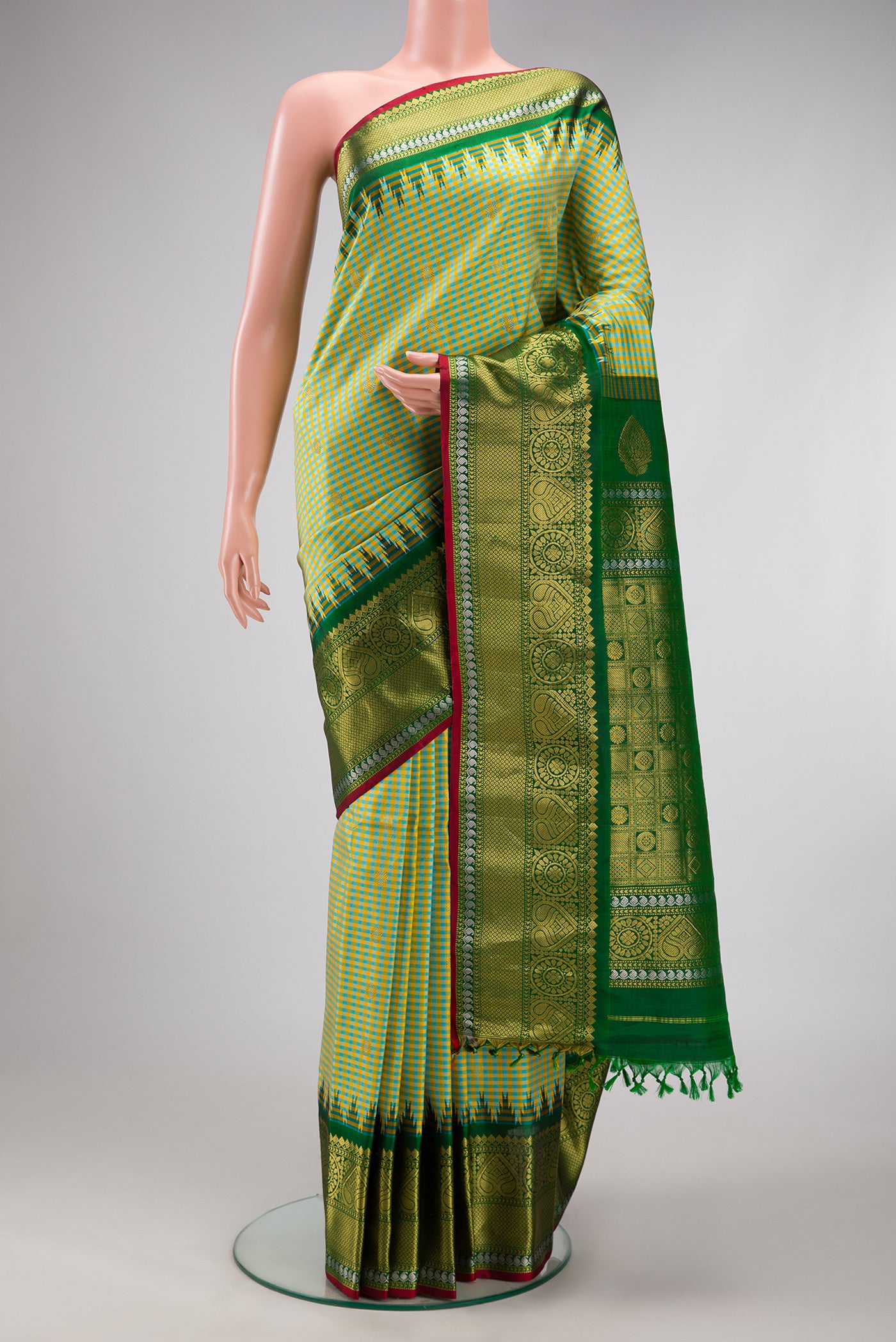 Pista Green Gadwal Silk Saree with Checked design on the body and Zari Border.  displayed on a mannequin
