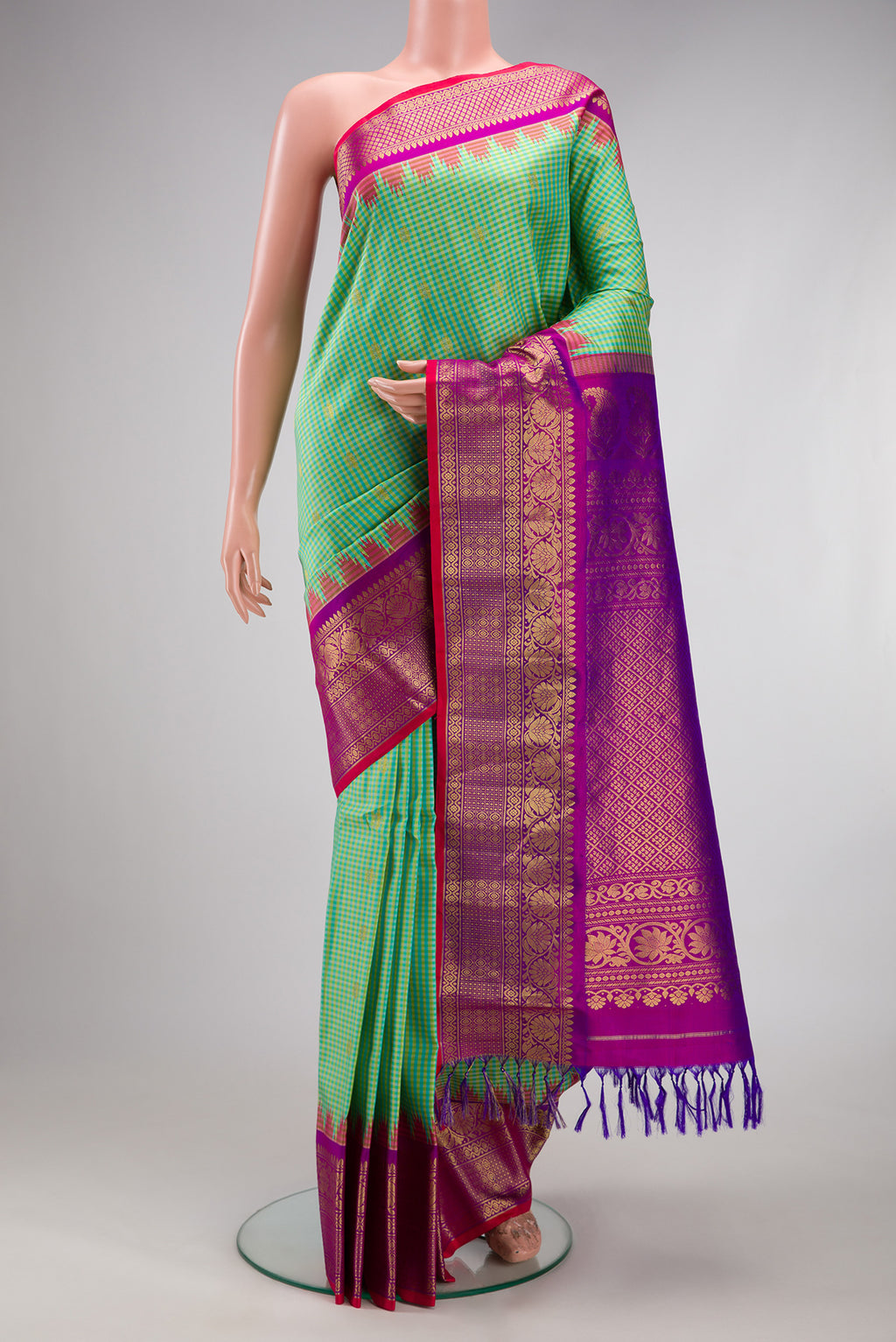 Sea Green Gadwal Silk Saree with Checked design on the body and Zari Border.  displayed on a mannequin