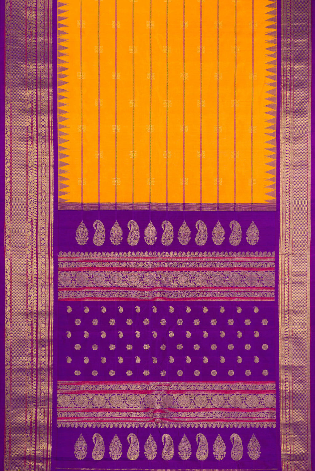 Flat view of Yellow Gadwal Silk Saree with Stripes on the body and Zari Border. 