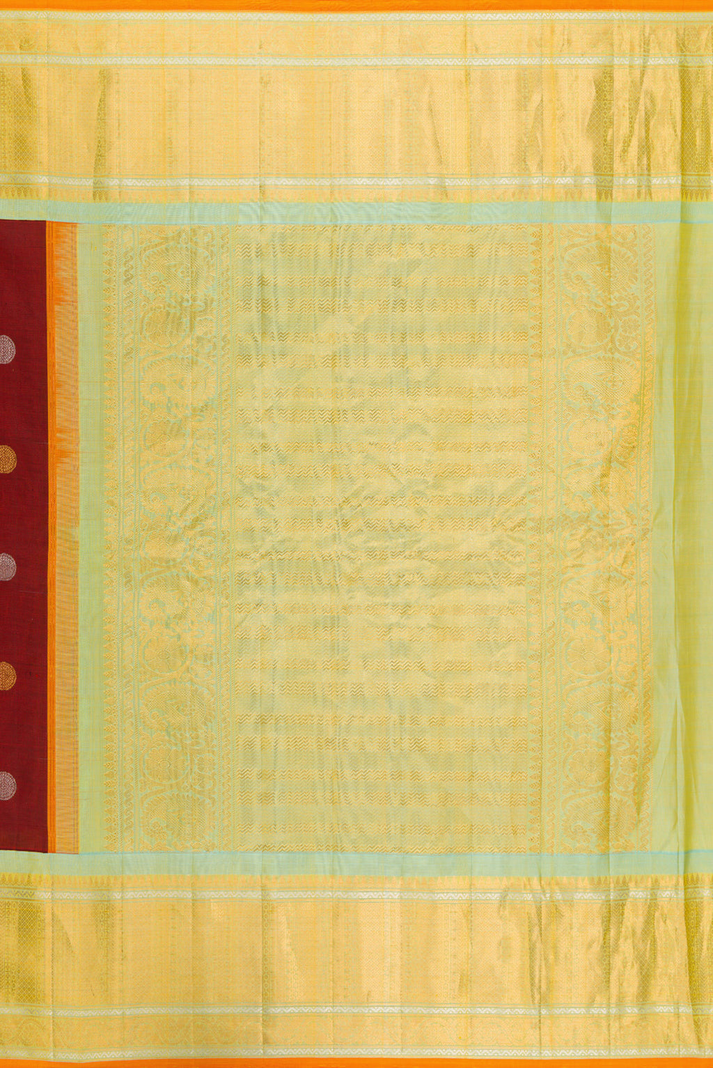 Close up image of the pallu of Maroon Gadwal Silk Saree with Zari Butta on the body and Zari Border. 