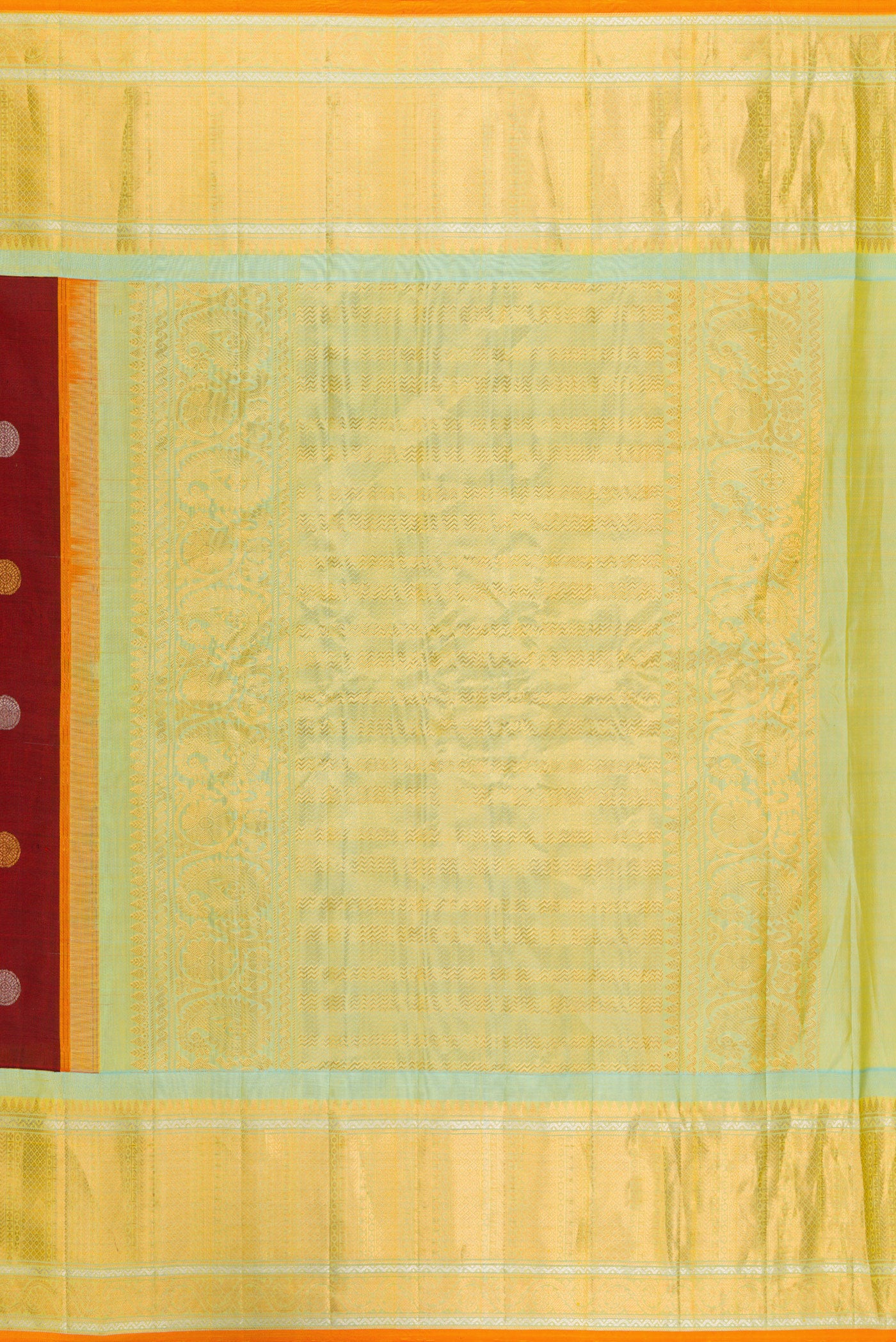 Close up image of the pallu of Maroon Gadwal Silk Saree with Zari Butta on the body and Zari Border. 