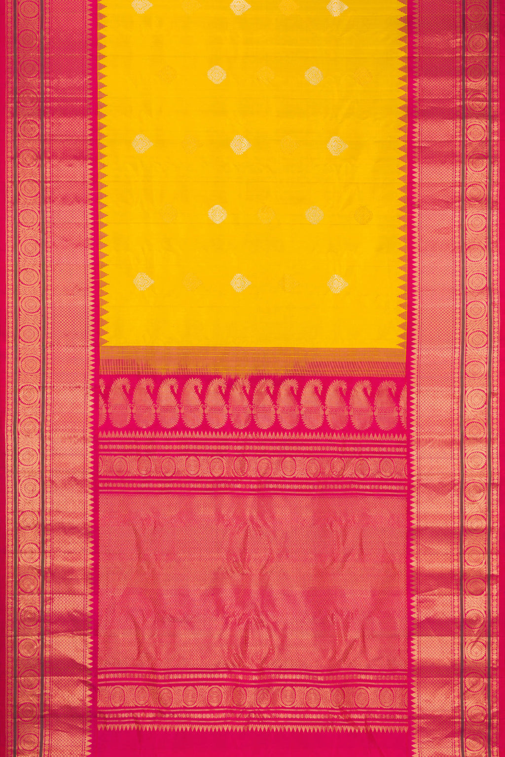 Flat view of Mustard Gadwal Silk Saree with Zari Butta on the body and Temple Border. 