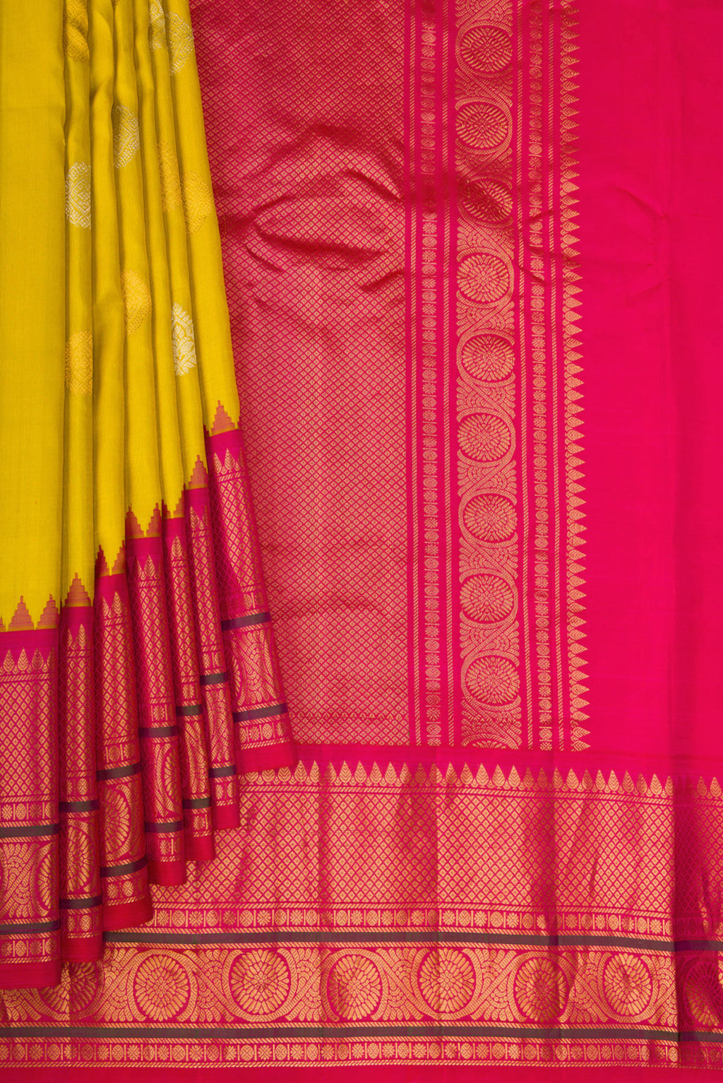 Pleats and pallu of Mustard Gadwal Silk Saree with Zari Butta on the body and Temple Border. 