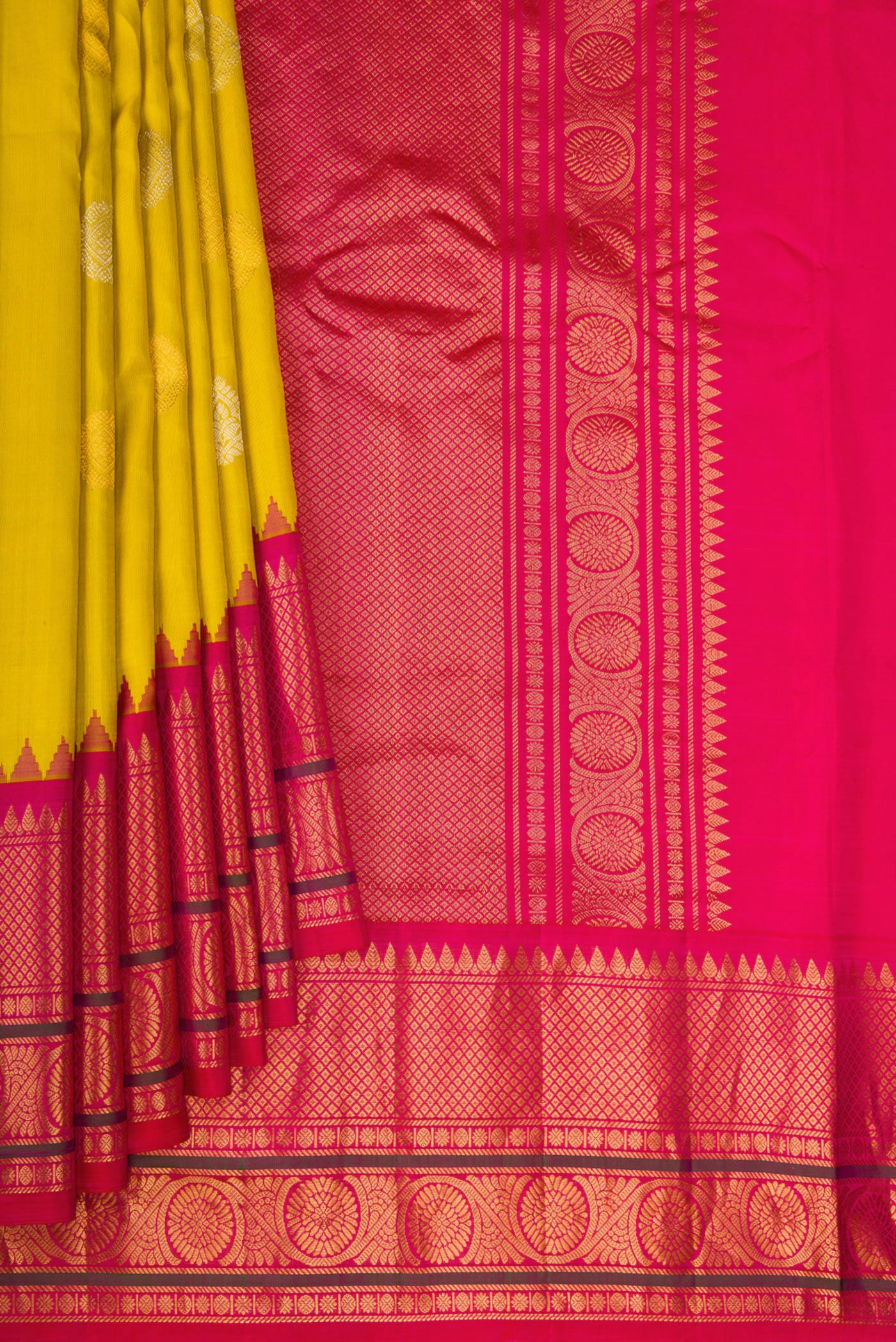Pleats and pallu of Mustard Gadwal Silk Saree with Zari Butta on the body and Temple Border. 