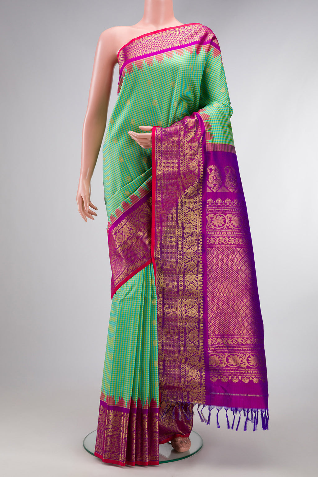 Sea Green Gadwal Silk Saree with Checked design on the body and Zari Border.  displayed on a mannequin