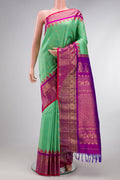 Sea Green Gadwal Silk Saree with Checked design on the body and Zari Border.  displayed on a mannequin