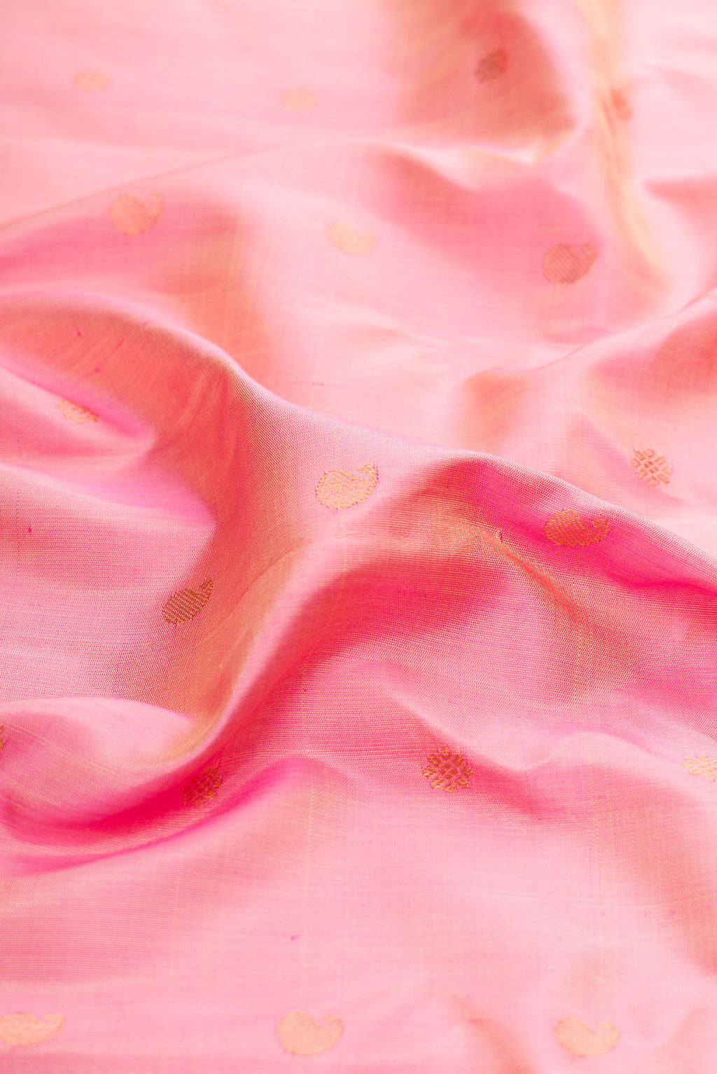 Close up of Rose pink Gadwal Silk Saree with Zari Butta on the body and Zari Border.  displaying folds
