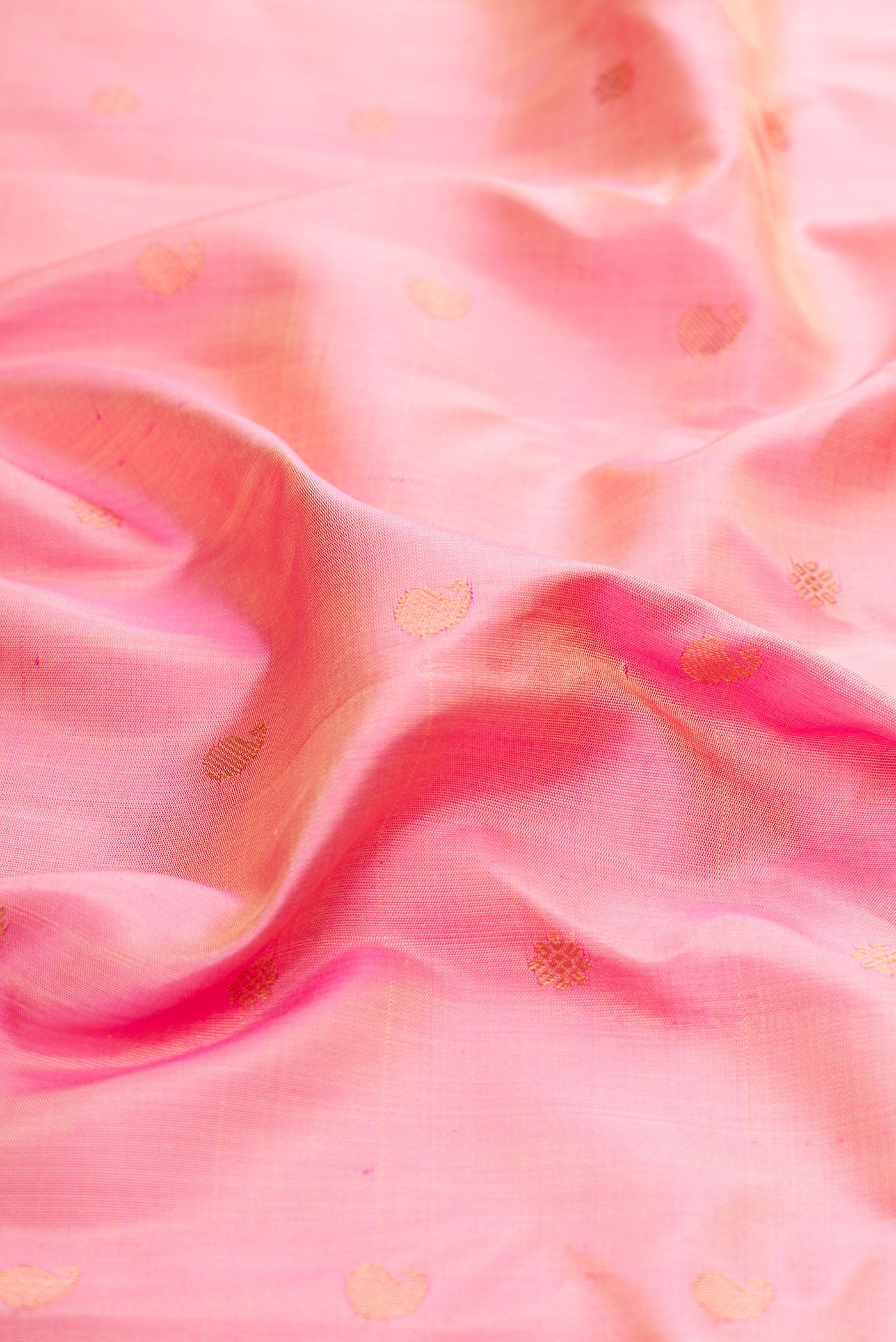 Close up of Rose pink Gadwal Silk Saree with Zari Butta on the body and Zari Border.  displaying folds