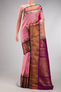 Rose pink Gadwal Silk Saree with Zari Butta on the body and Zari Border.  displayed on a mannequin