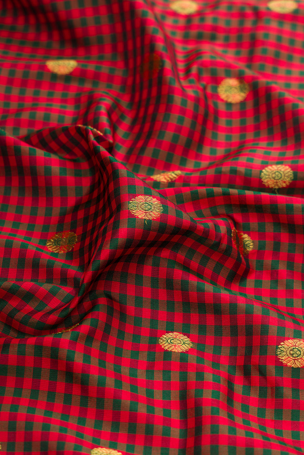 Close up of Multi Color Gadwal Silk Saree with Checked design on the body and Zari Border.  displaying folds