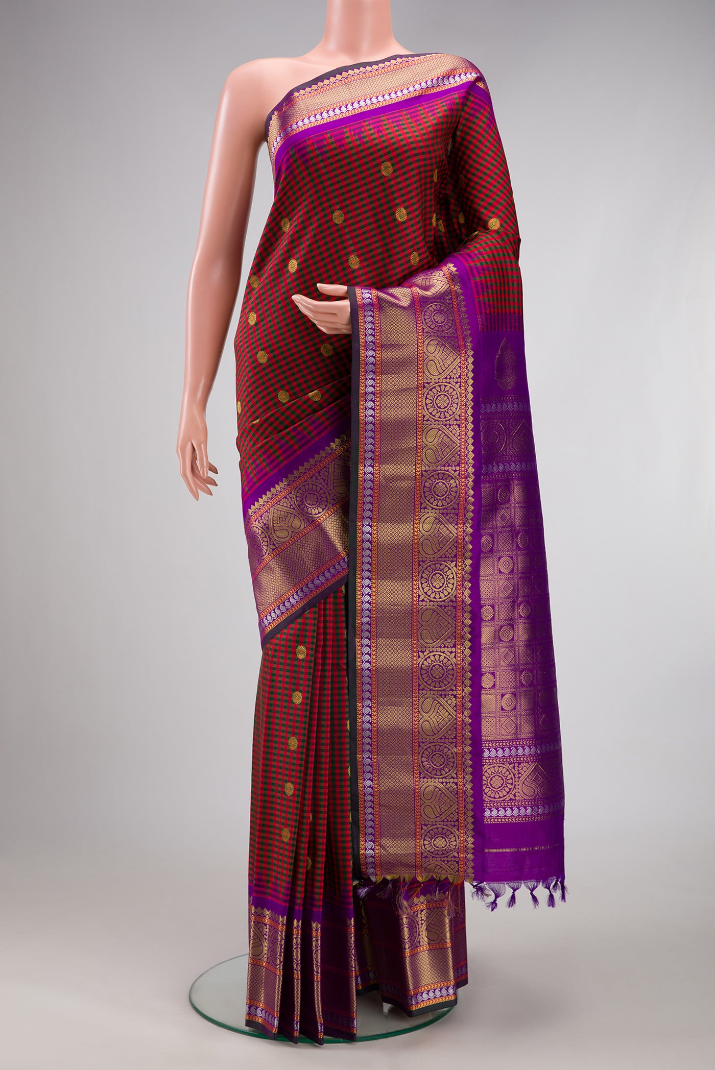 Multi Color Gadwal Silk Saree with Checked design on the body and Zari Border.  displayed on a mannequin
