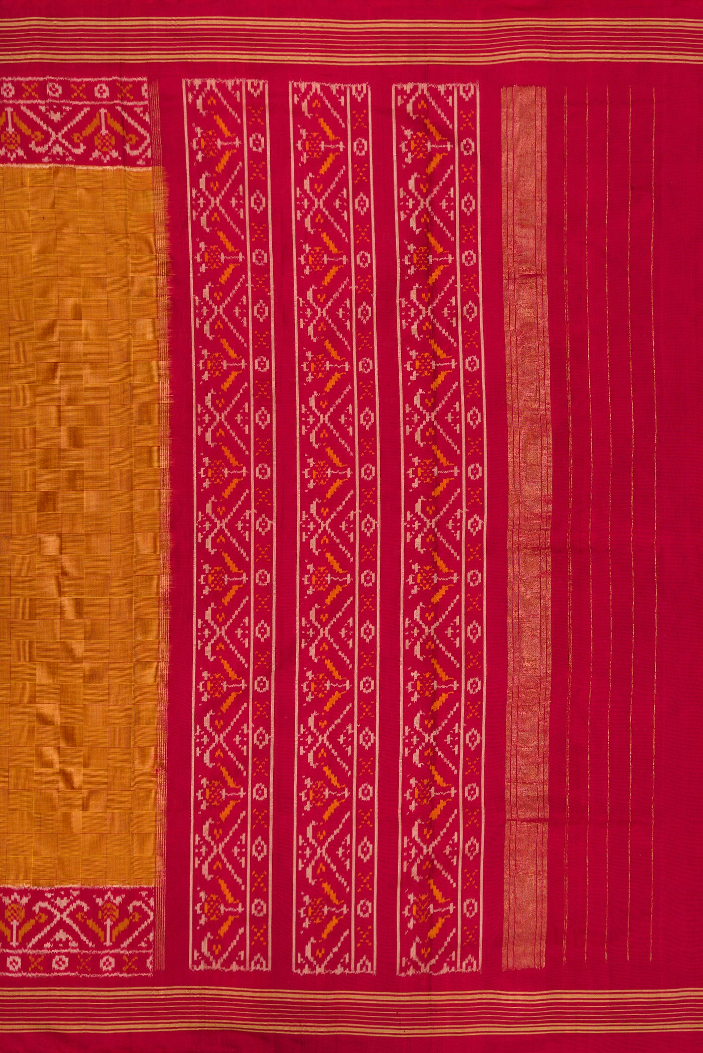 Close up image of the pallu of Mustard Double Ikat Saree with Checked design on the body and Ikat Border. 