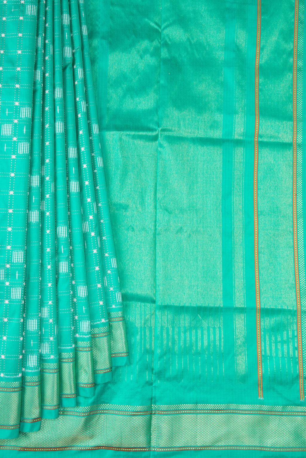 Pleats and pallu of Sea Green Double Ikat Saree with Pure Ikat on the body and Zari Border. 