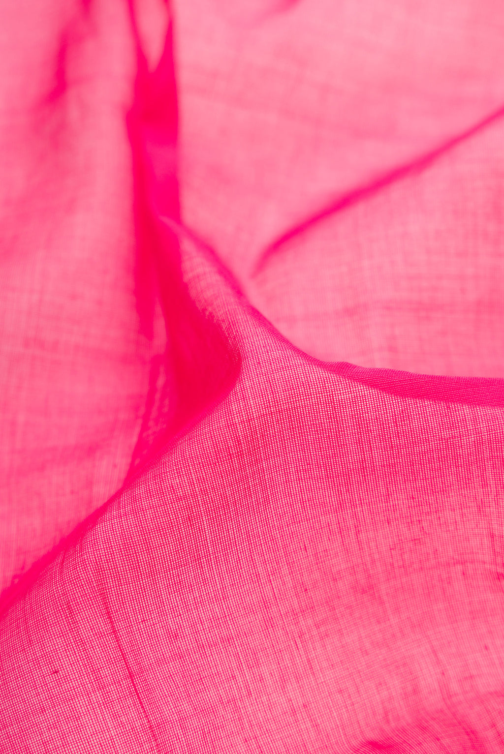 Close up of Pink Uppada Cotton Saree with Plain Body and Zari Border.  displaying folds