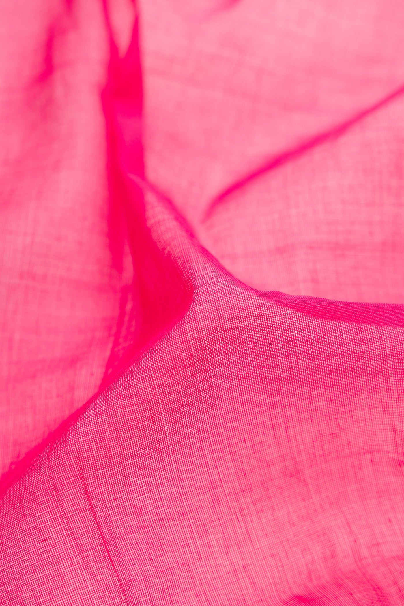 Close up of Pink Uppada Cotton Saree with Plain Body and Zari Border.  displaying folds