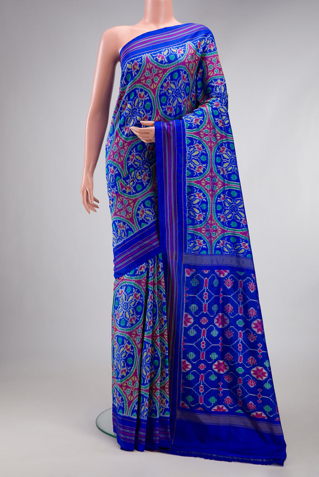 Royal Blue Double Ikat Saree with Pure Ikat on the body and Thread Border.  displayed on a mannequin
