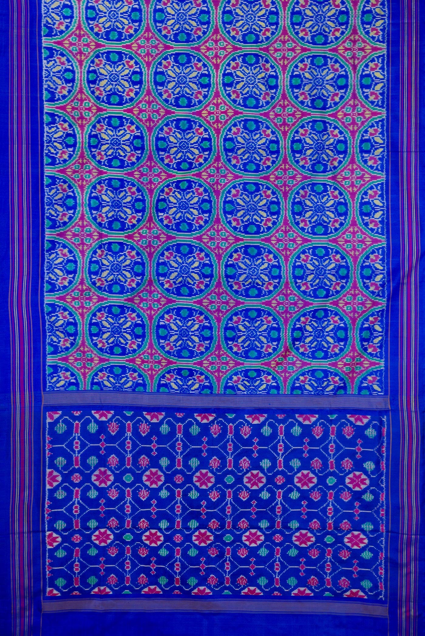 Flat view of Royal Blue Double Ikat Saree with Pure Ikat on the body and Thread Border. 