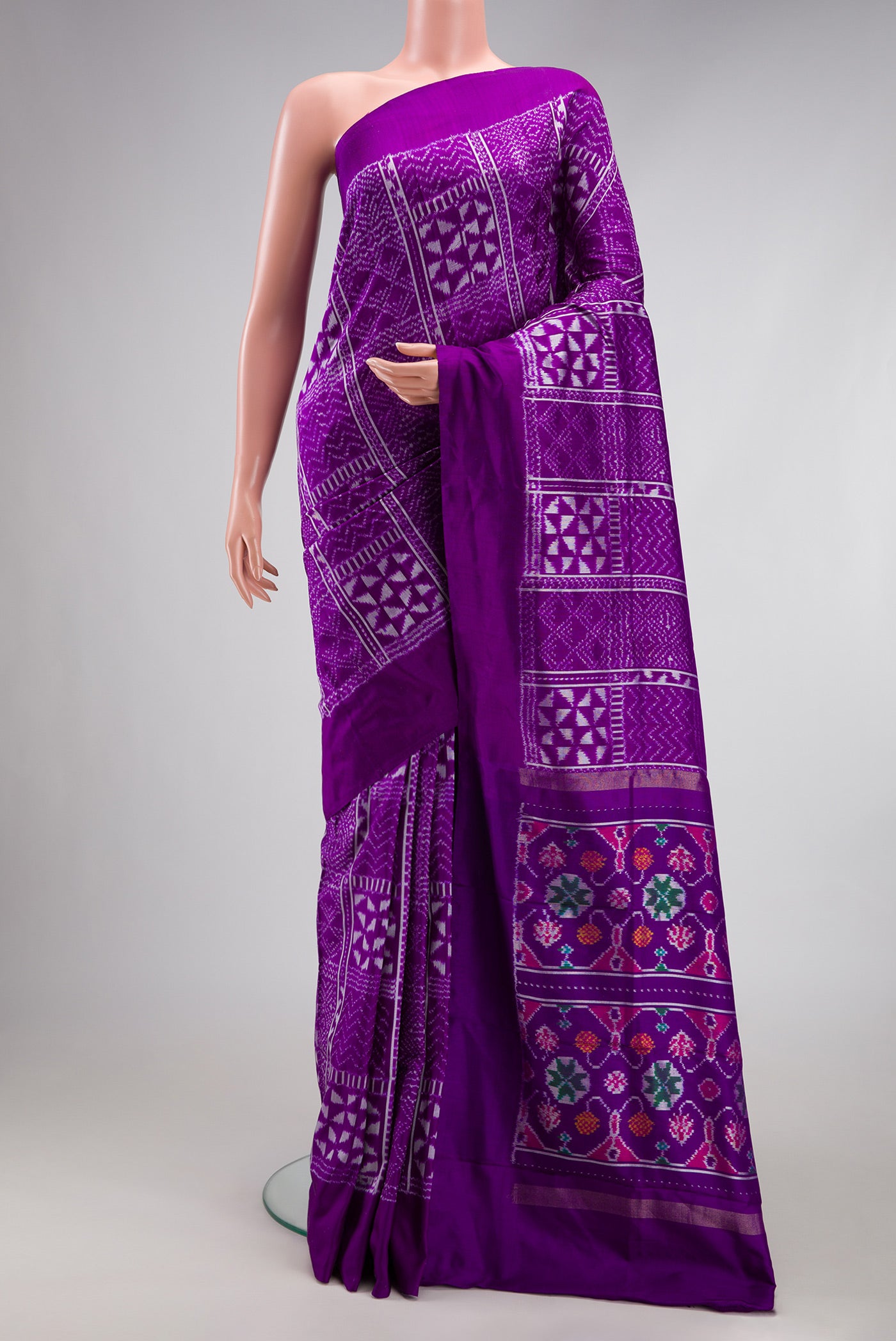 Violet Double Ikat Saree with Pure Ikat on the body and Plain Border.  displayed on a mannequin