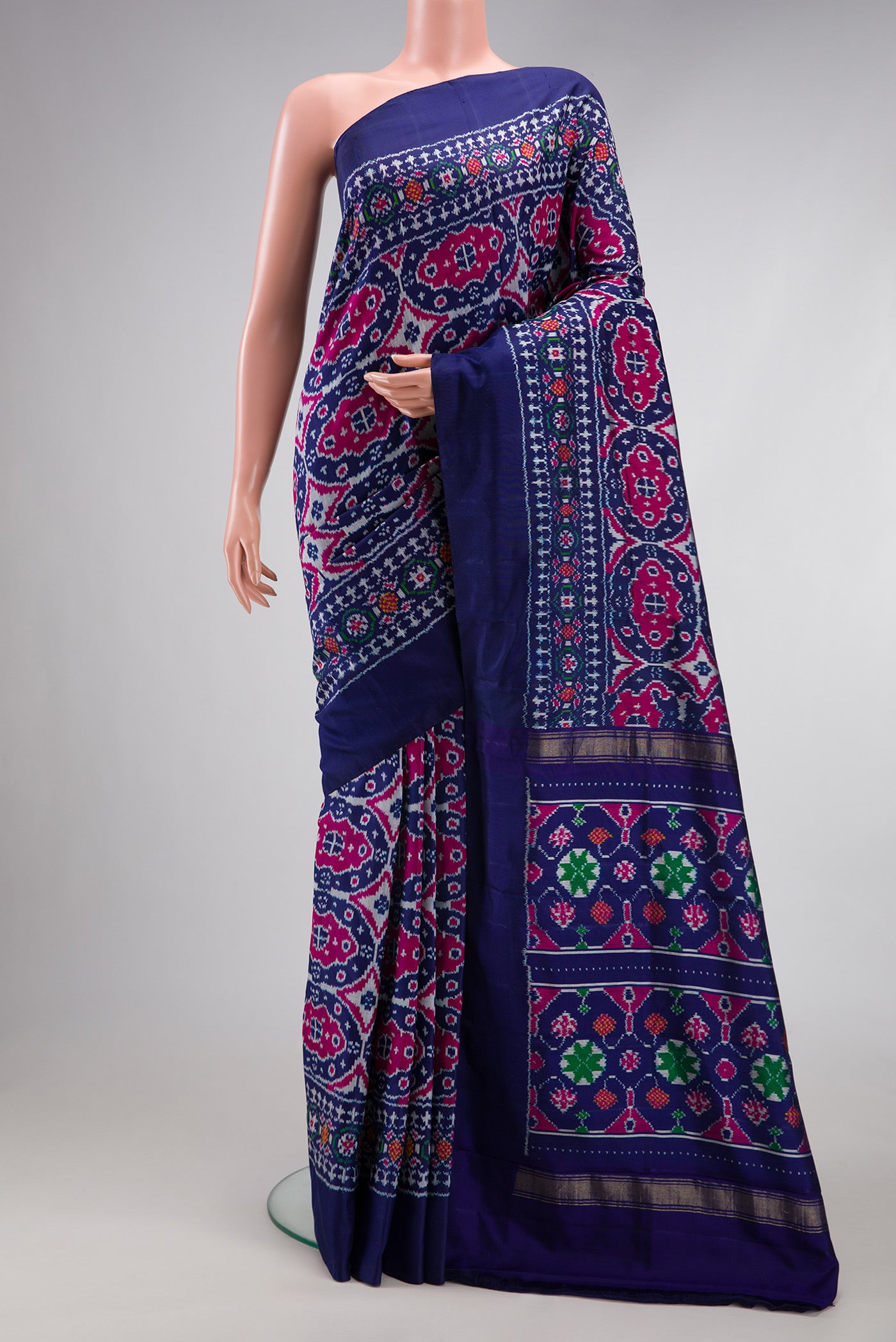 Navy Blue Double Ikat Saree with Pure Ikat on the body and Plain Border.  displayed on a mannequin