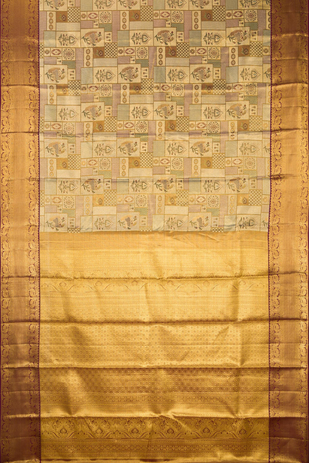 Flat view of Gold Dual Tone Kanjivaram Tissue Saree with Zari Brocade on the body and Fancy Border. 