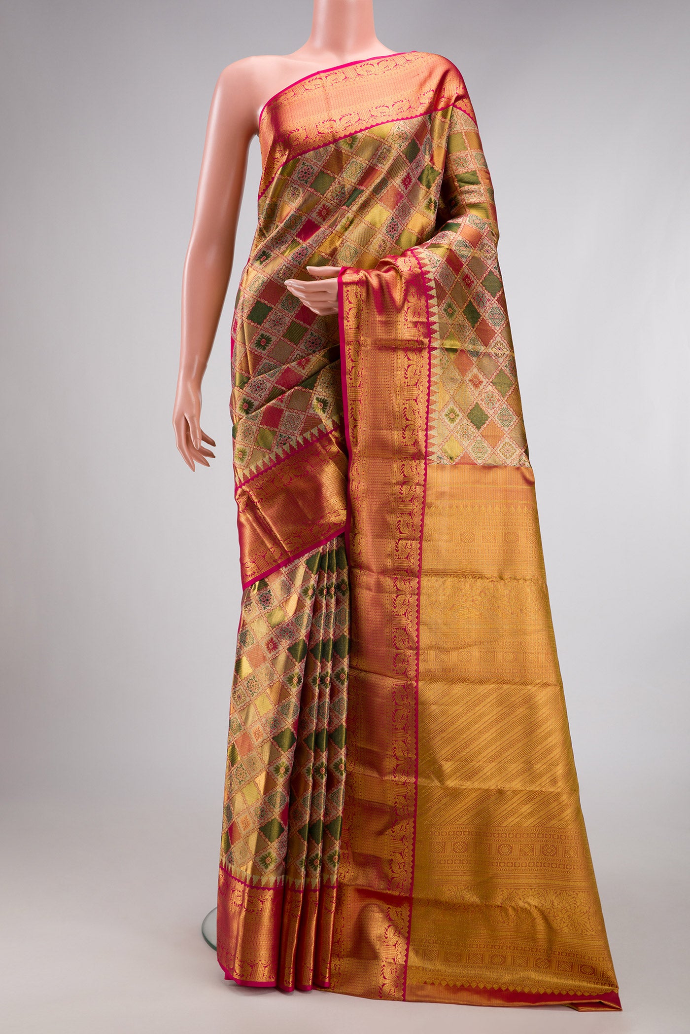 Green and Pink Color Kanjivaram Tissue Silk Saree with Zari Brocade on the body and Fancy Border.  displayed on a mannequin