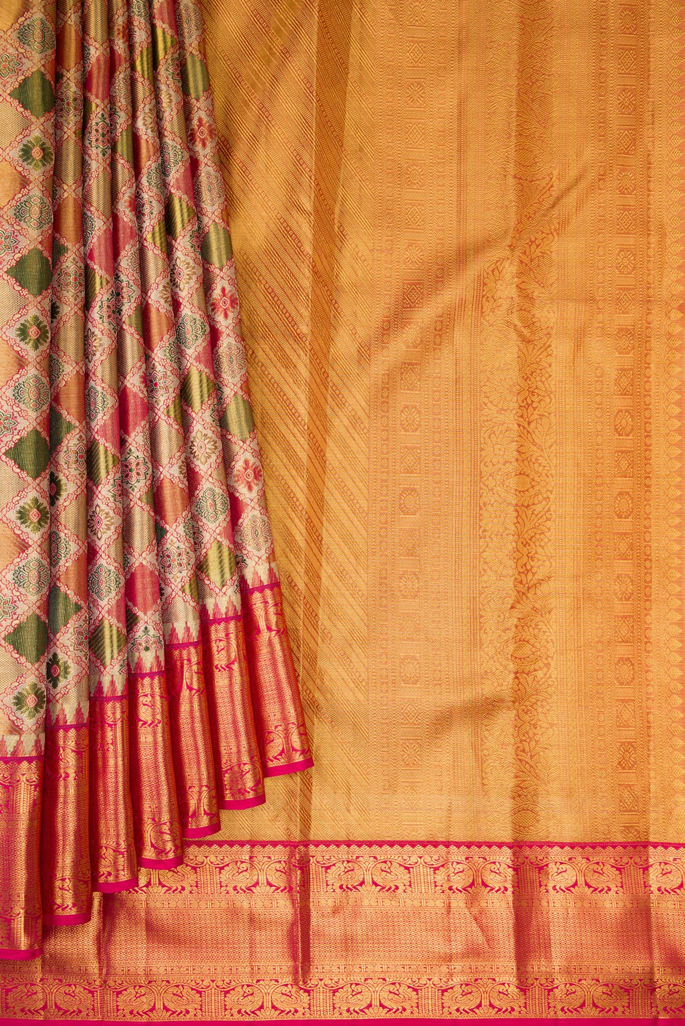 Pleats and pallu of Green and Pink Color Kanjivaram Tissue Silk Saree with Zari Brocade on the body and Fancy Border. 