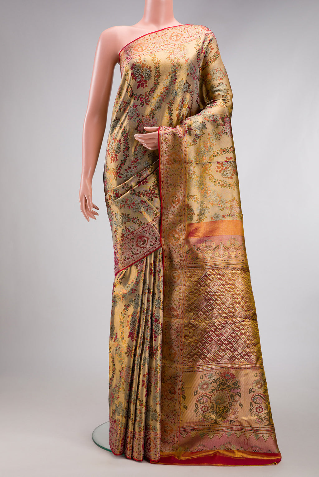 Gold Dual Tone Kanjivaram Tissue Silk Saree with Zari Brocade on the body and Fancy Border.  displayed on a mannequin