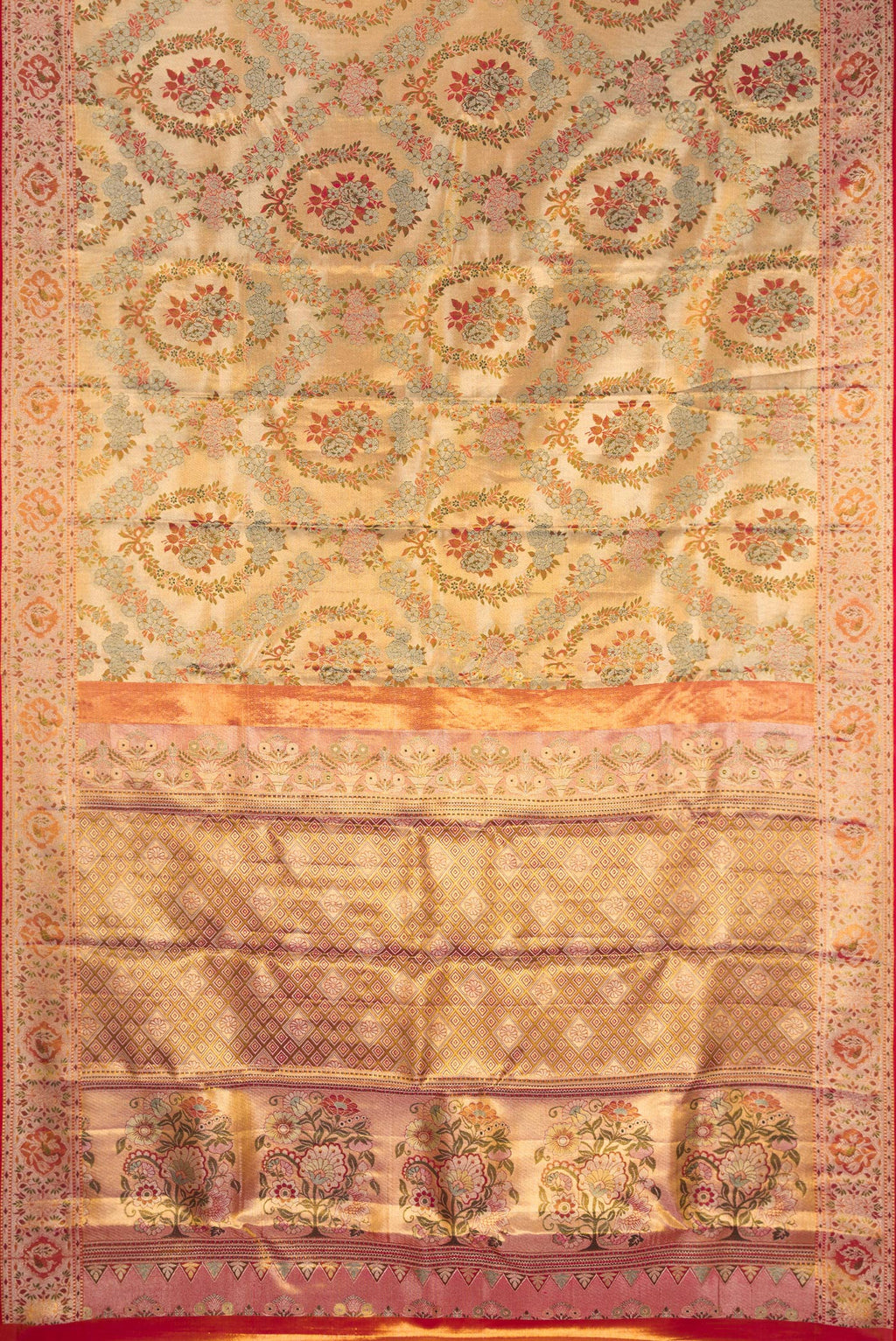 Flat view of Gold Dual Tone Kanjivaram Tissue Silk Saree with Zari Brocade on the body and Fancy Border. 